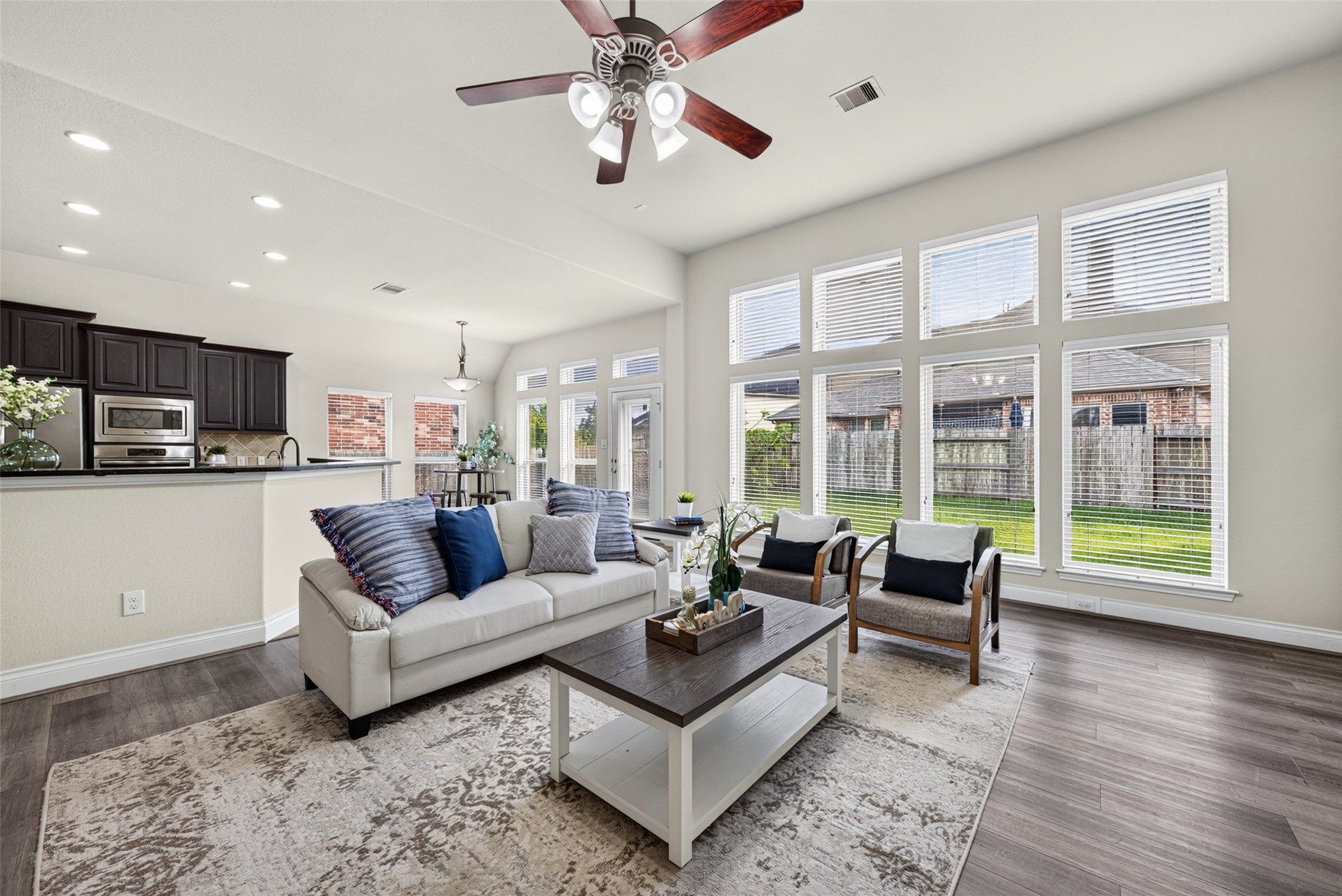 Warm and joyful family room with sunny windows that bring the outdoors right inside.