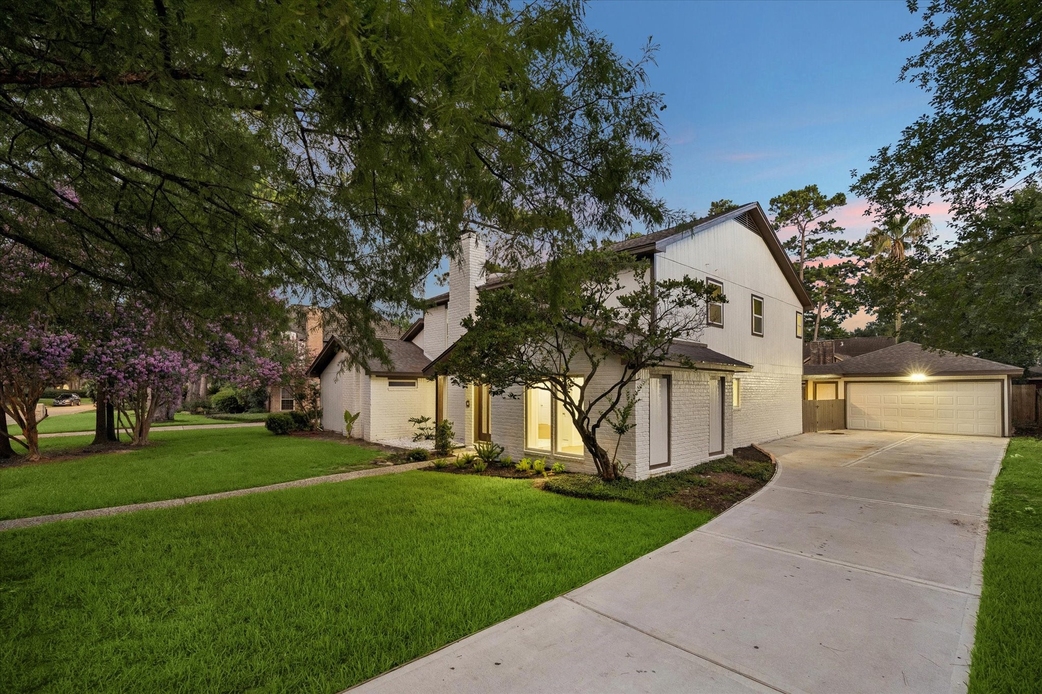 long 75ft+ driveway, detached garage with covered walkway.