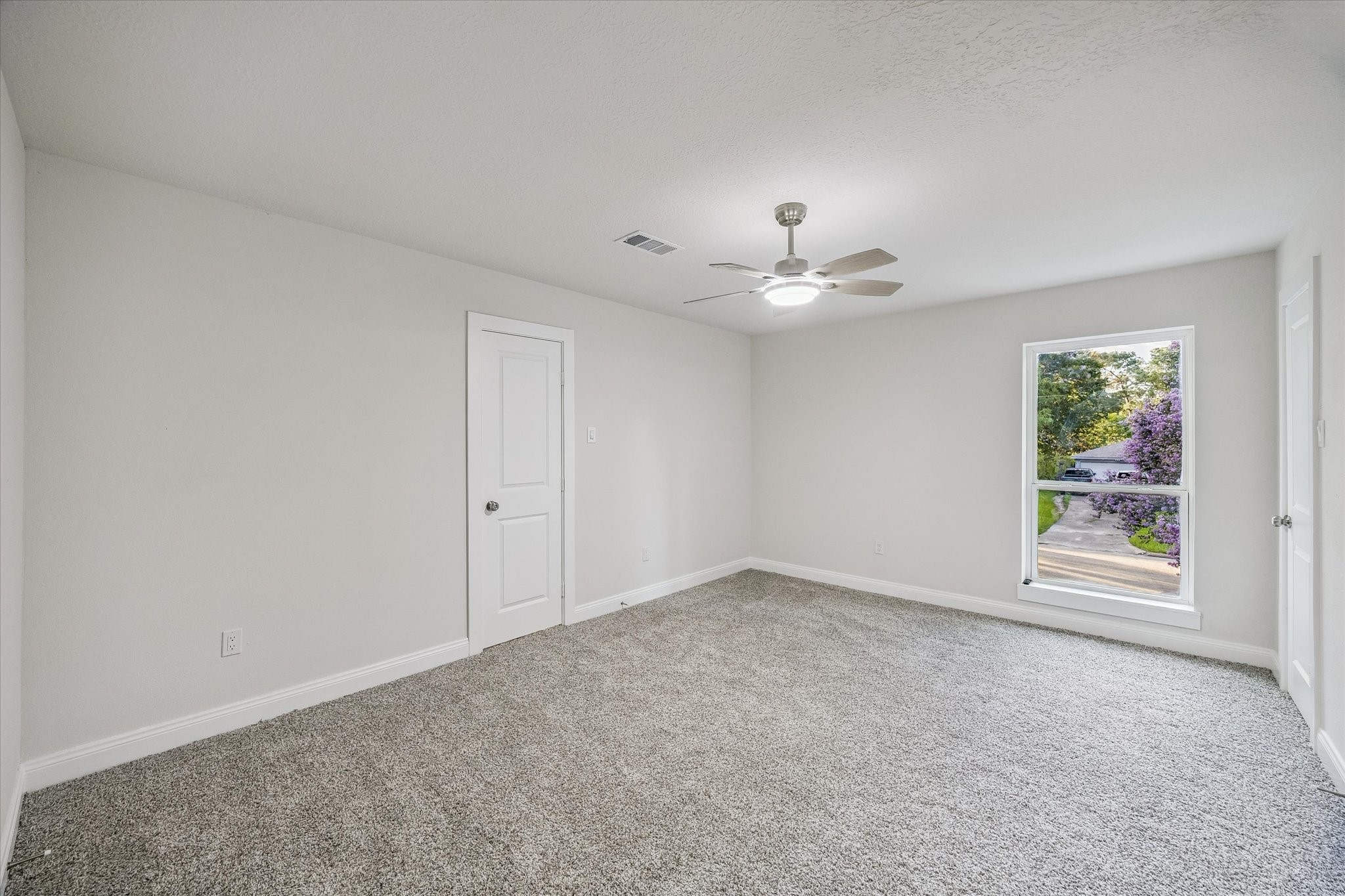 10x17 2nd floor bedroom. newly laid carpet throughout the second floor.