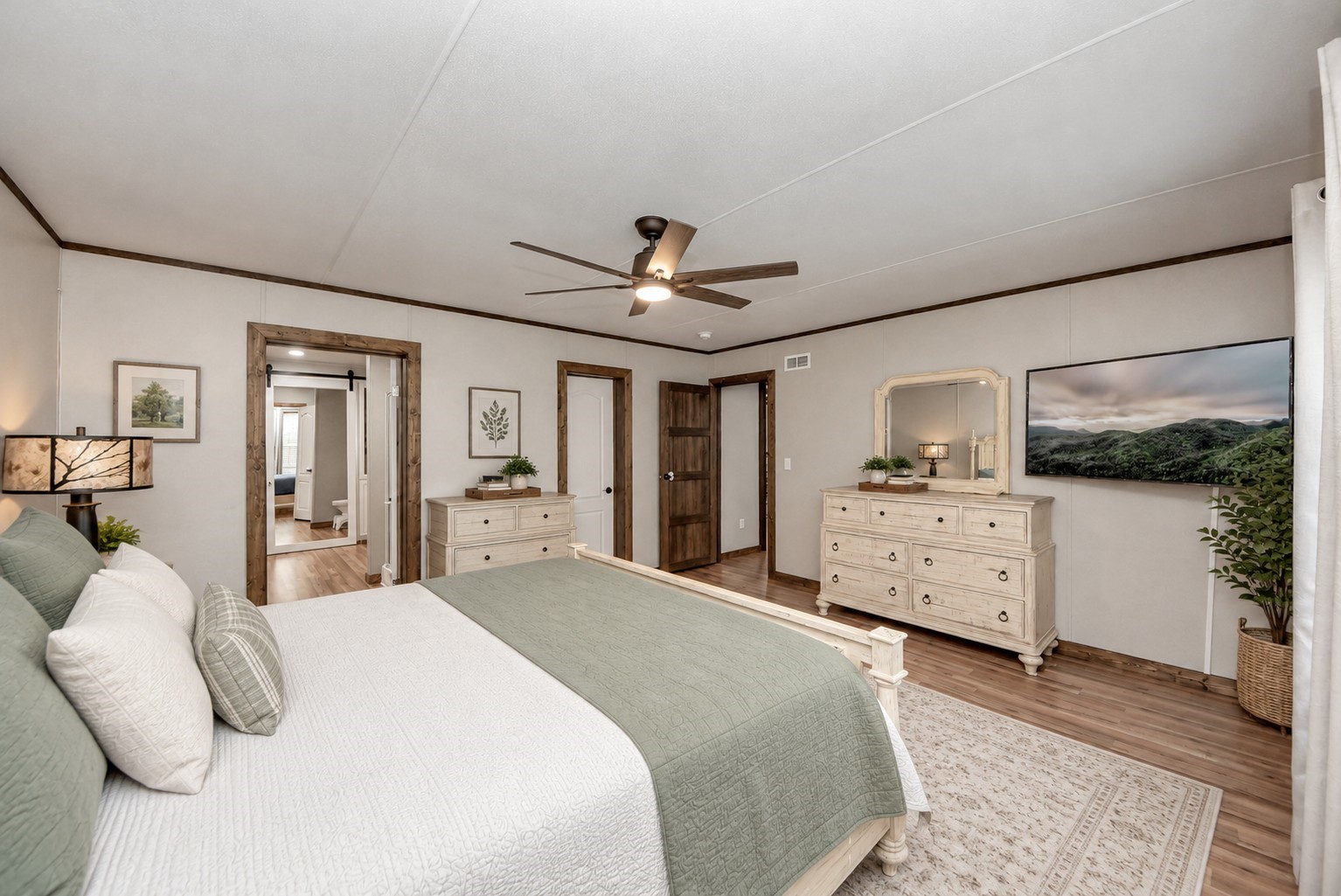 Virtually staged primary bedroom with ensuite bathroom.