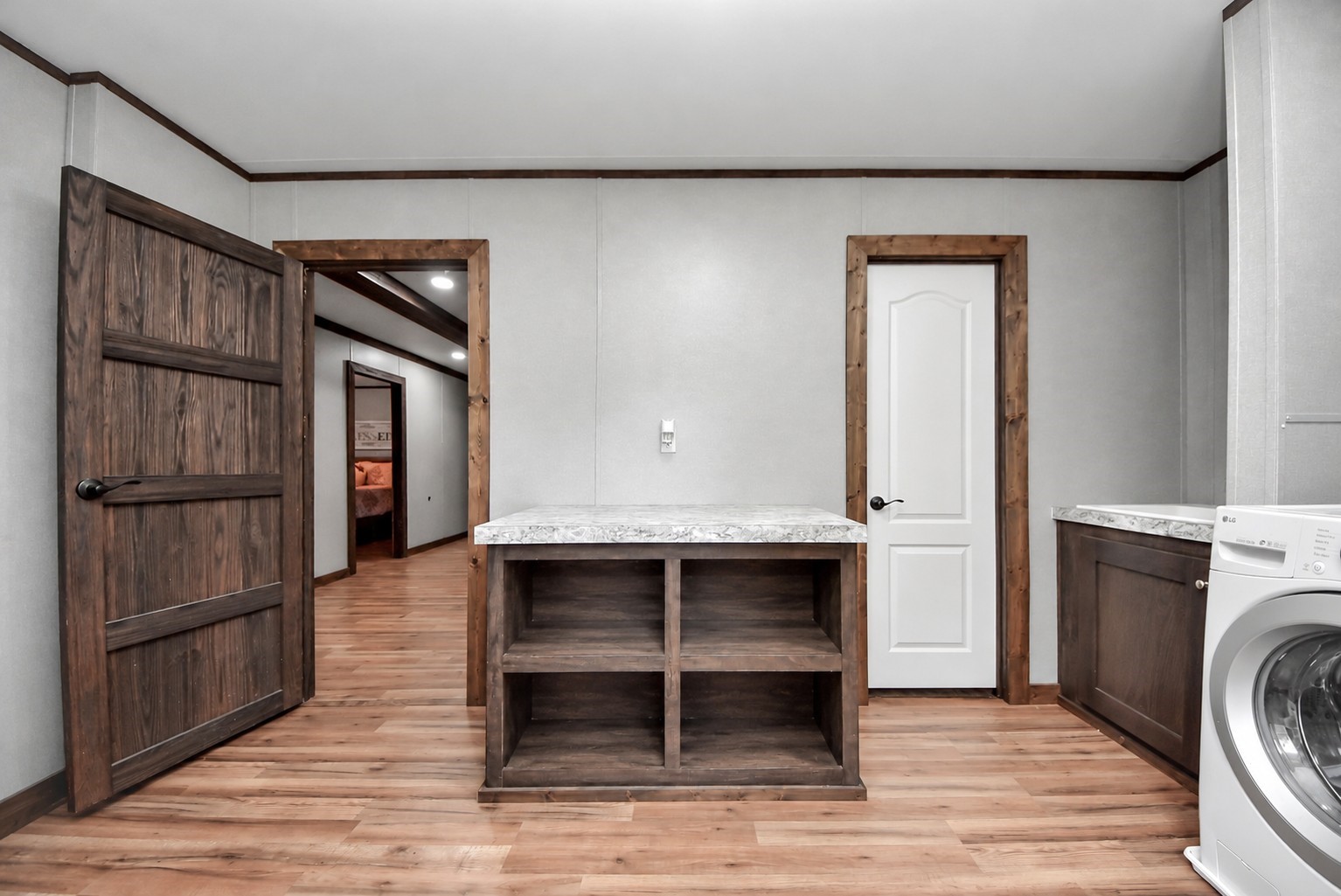 Another angle highlighting the spacious layout, built-in storage, and countertop workspace.