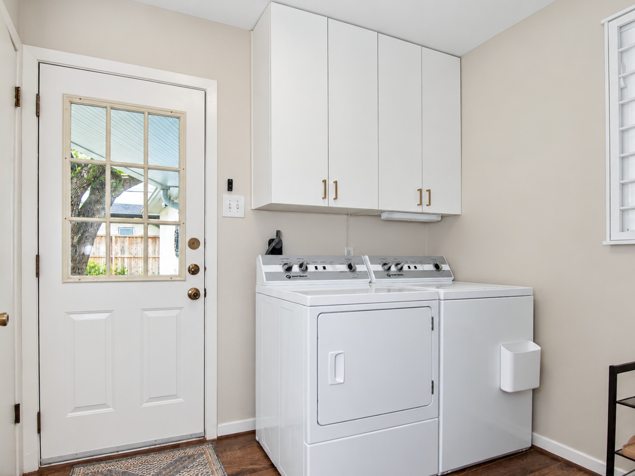 Large walk in laundry room with ample storage space