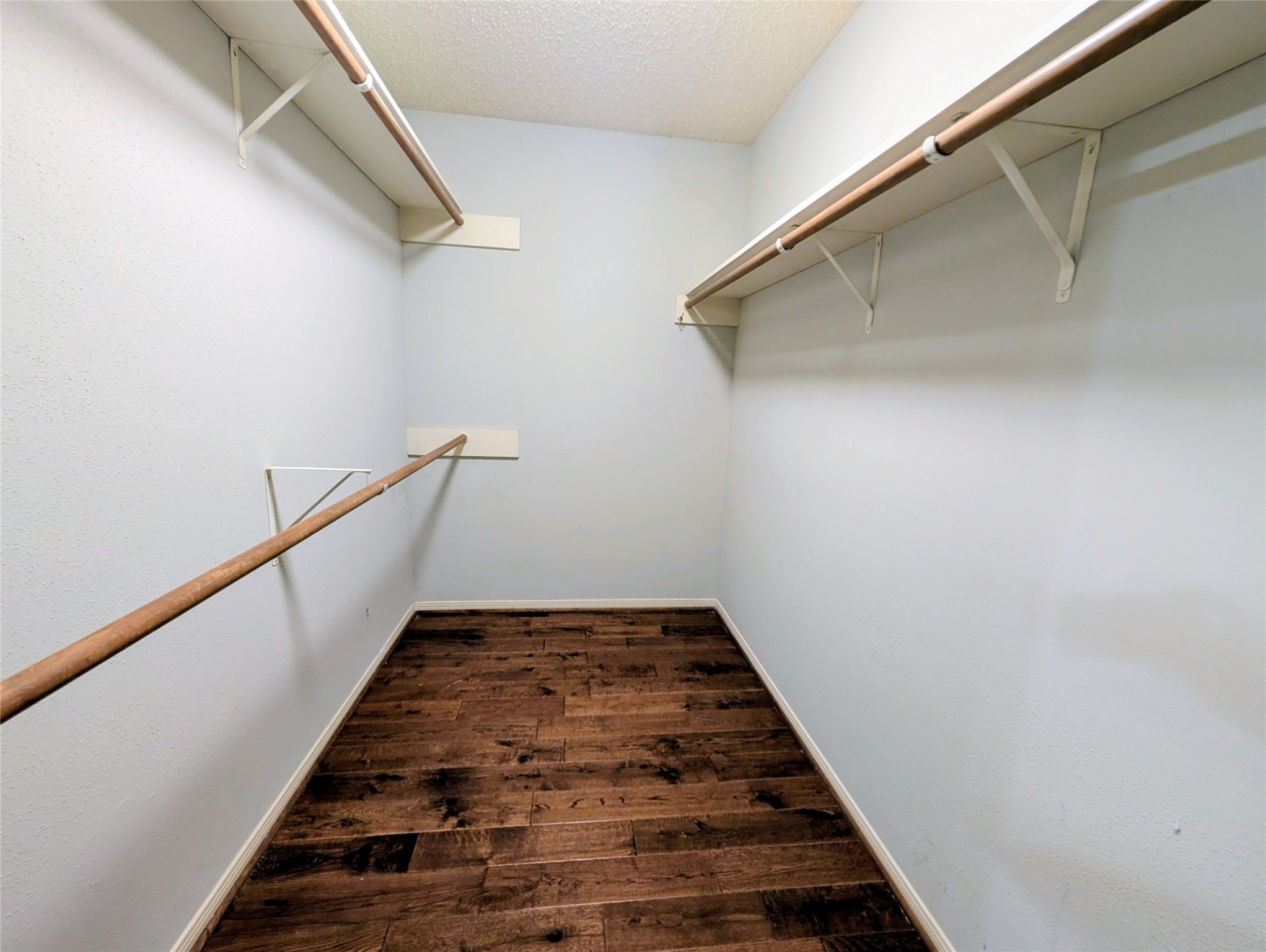 Double Sided Primary bedroom closet