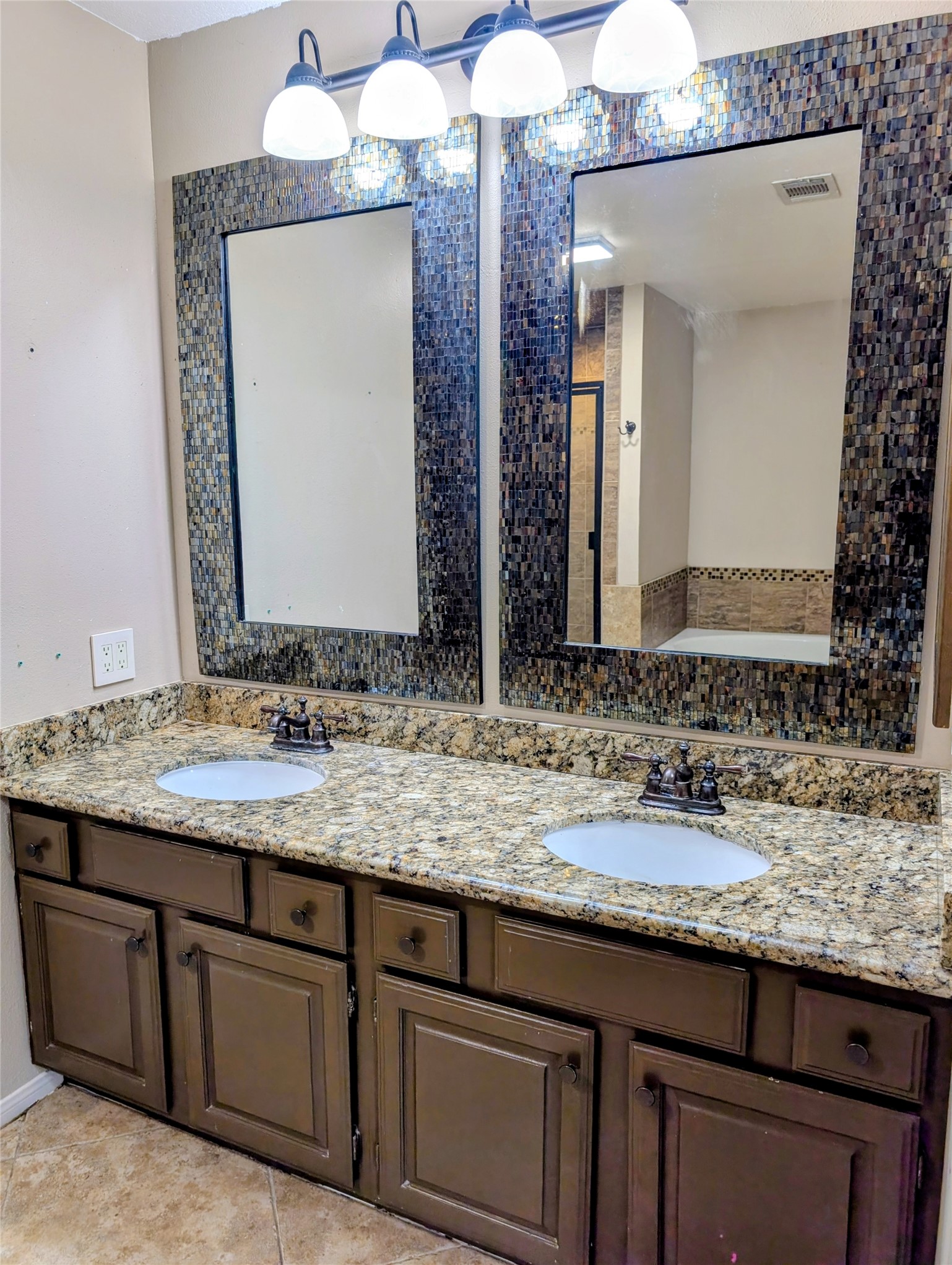 Primary Bathroom with Double Vanities and Double Mirrors