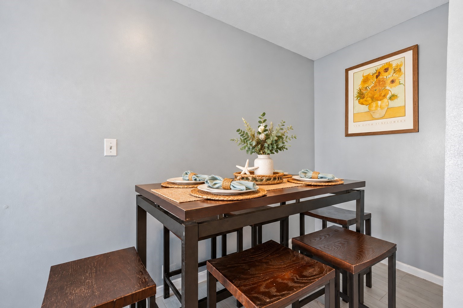 Second-Floor Dining Nook: Second-floor dining area featuring seating for four and neutral coastal-inspired finishes. Conveniently located near the kitchen, this inviting space is ideal for casual dining and entertaining family or vacation guests.