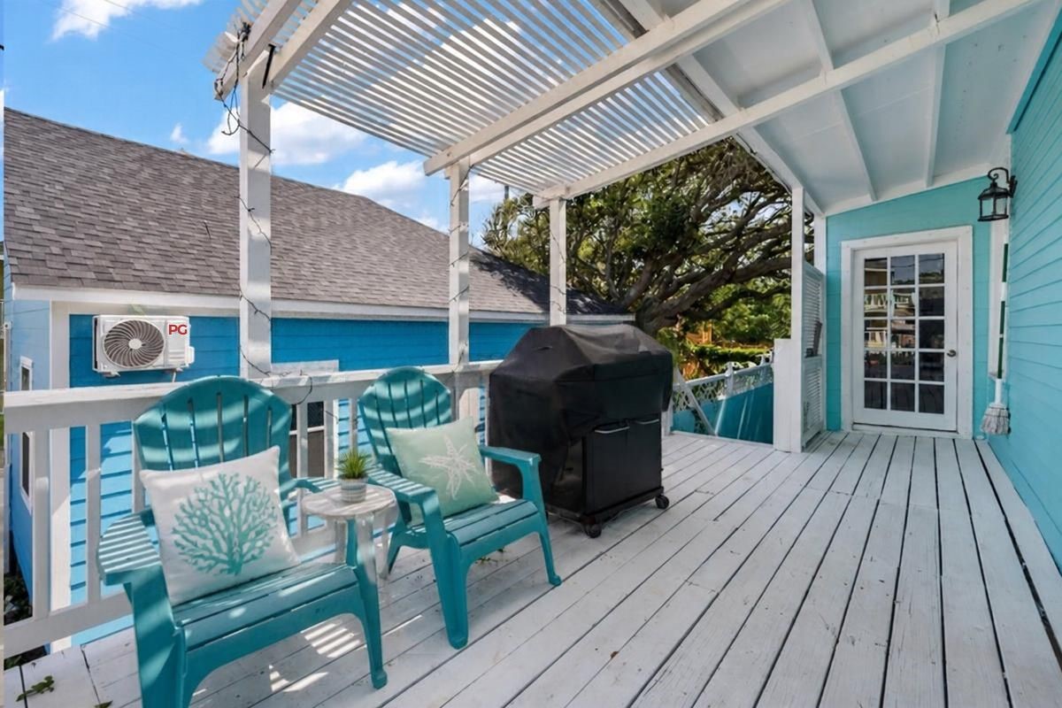 Second-Floor Outdoor Deck: Embrace the Galveston coastal lifestyle on this inviting second-floor deck featuring a charming pergola, outdoor seating, and grilling area. With direct access from the living room, this outdoor retreat is perfect for entertaining, relaxing in the Gulf breeze, or unwinding after a day at the beach!