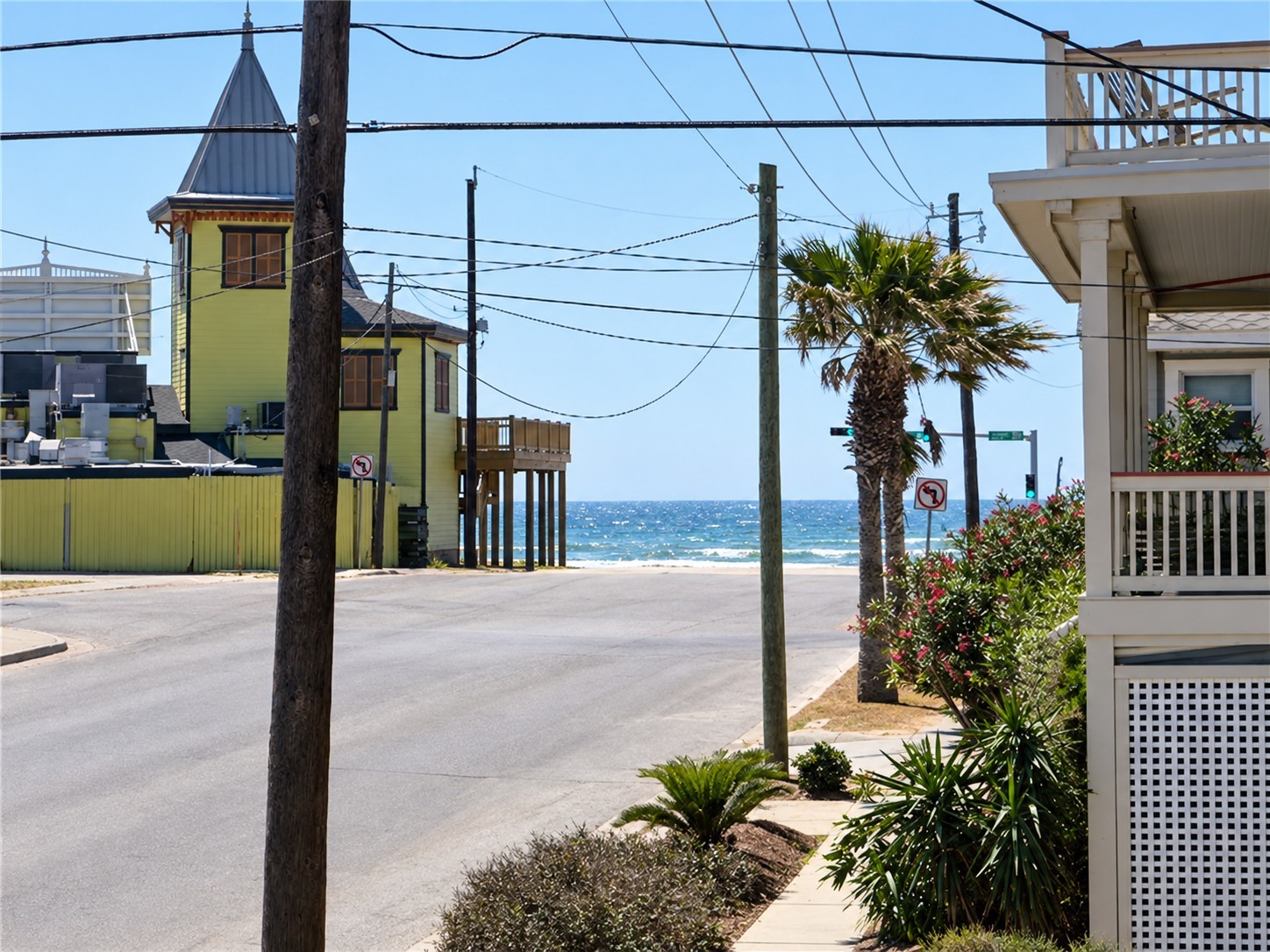 Imagine being just approximately 1 blocks from the beautiful Gulf of Mexico! This street-level view showcases the sparkling Gulf waters at the end of the street, highlighting the property's desirable coastal location. An established, thriving vacation rental offering guests convenient beach access and the opportunity to enjoy everything Galveston Island has to offer!