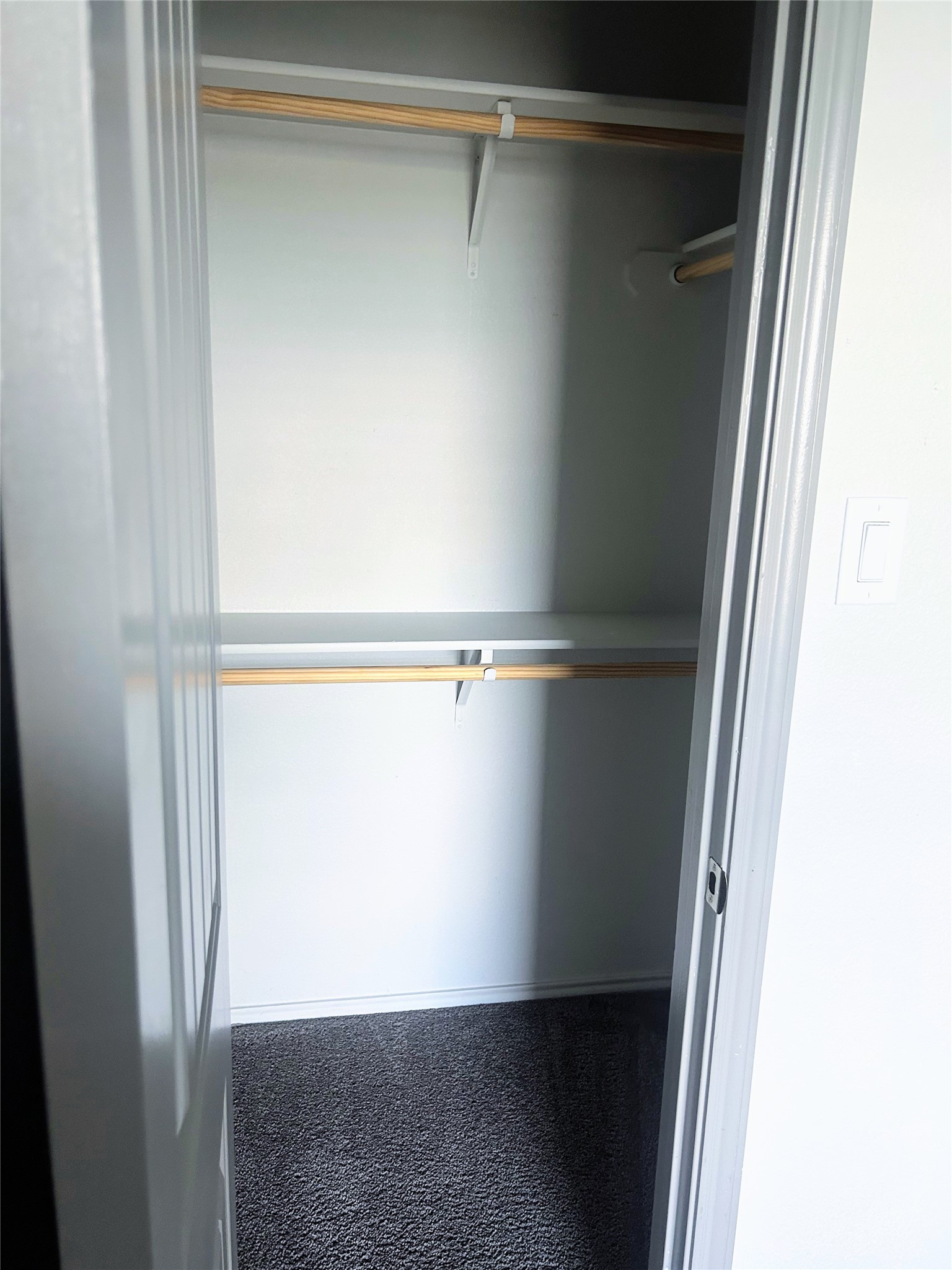 Second bedroom closet with 3 storage shelves