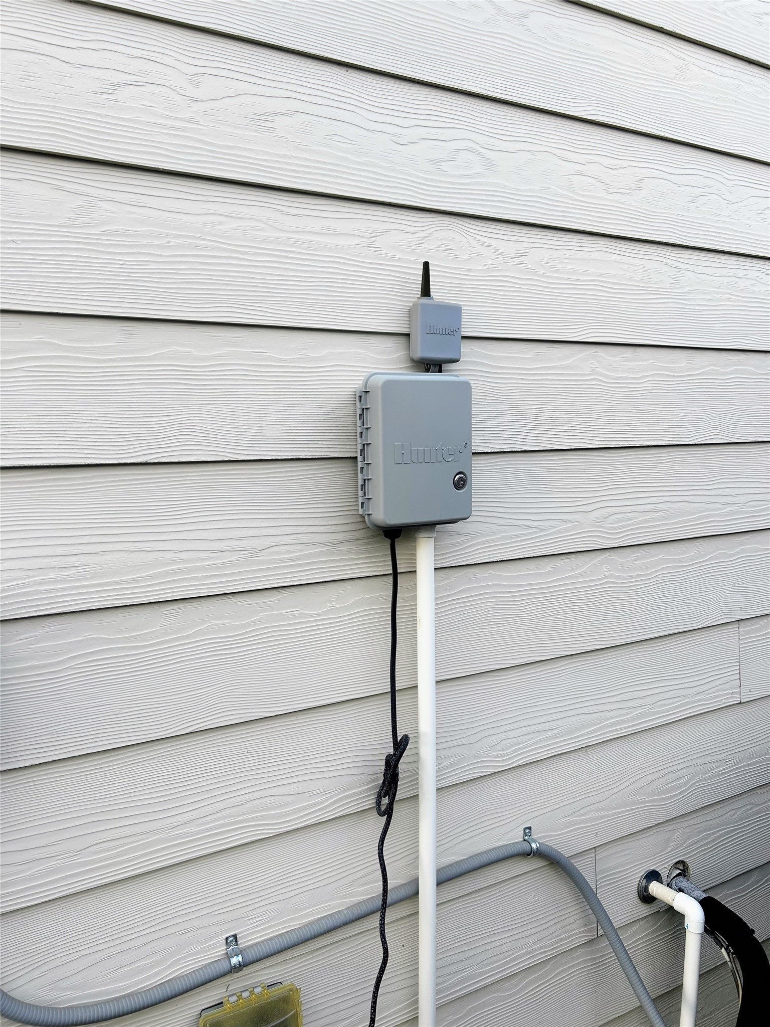 sprinkler system on the right side of home