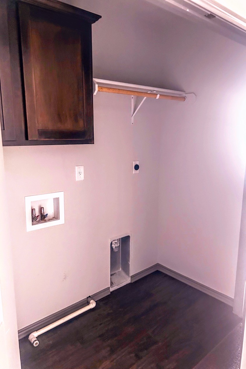 laundry room with storage space
