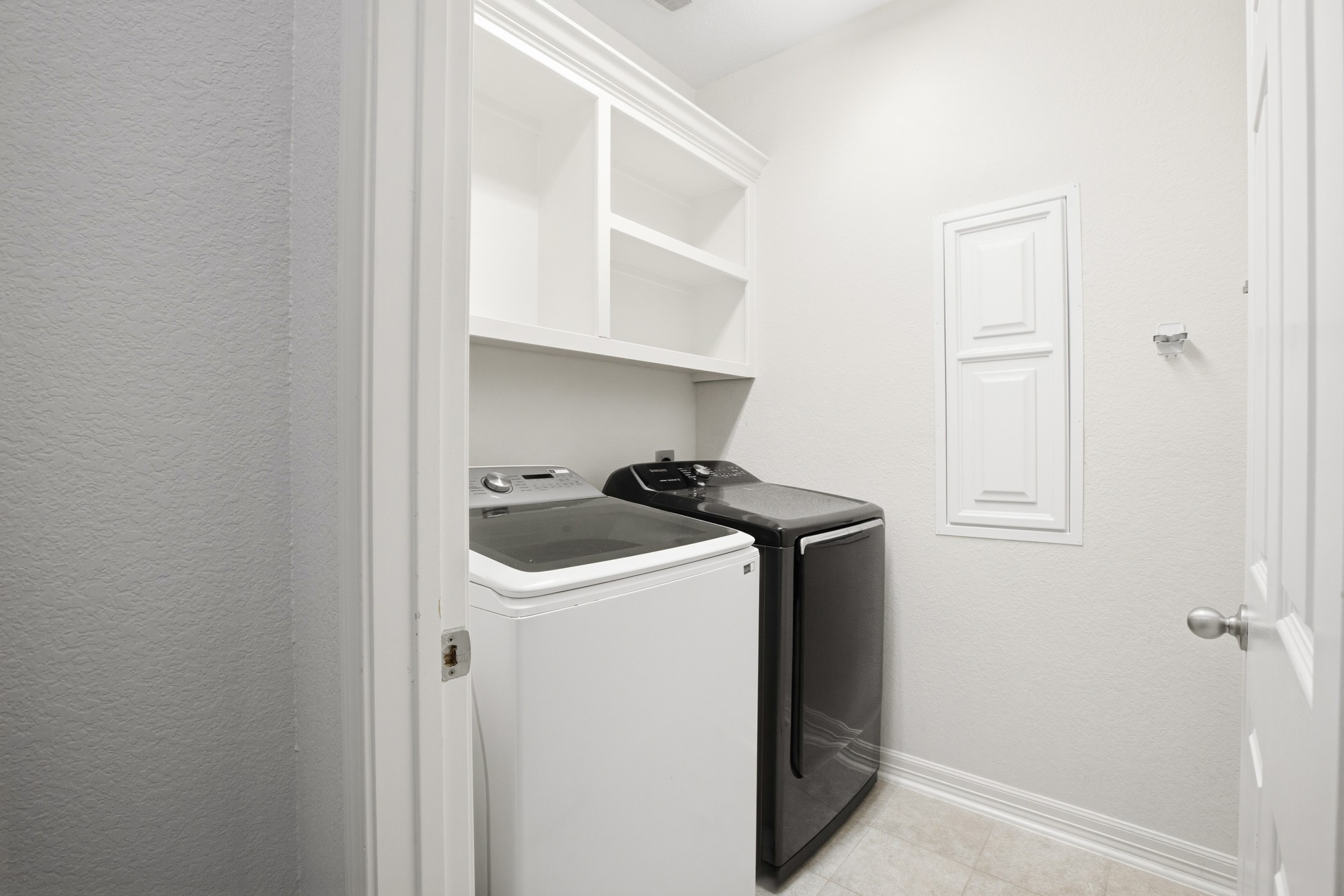Laundry room downstairs with appliances included