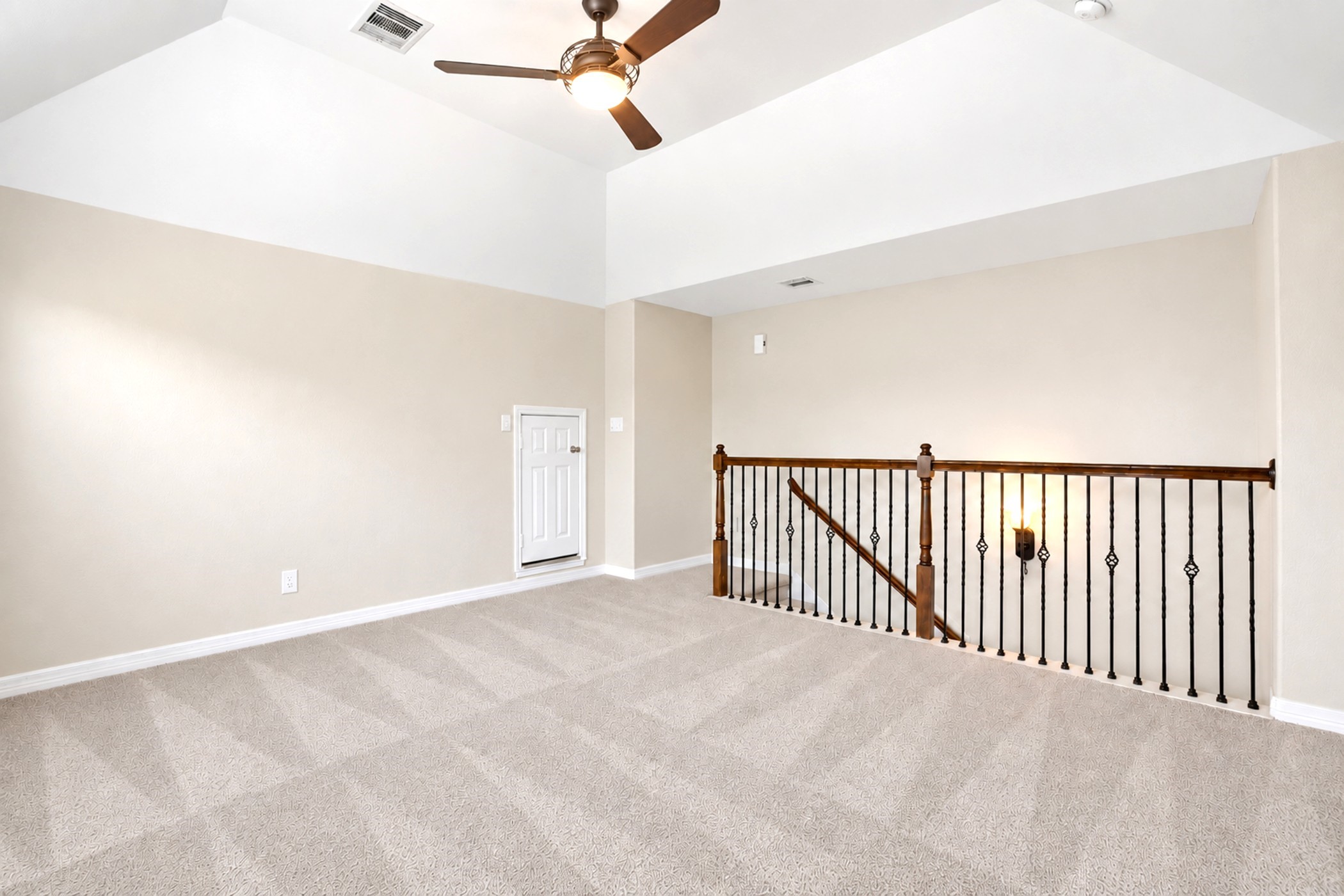 Flex space upstairs with high ceilings and fan