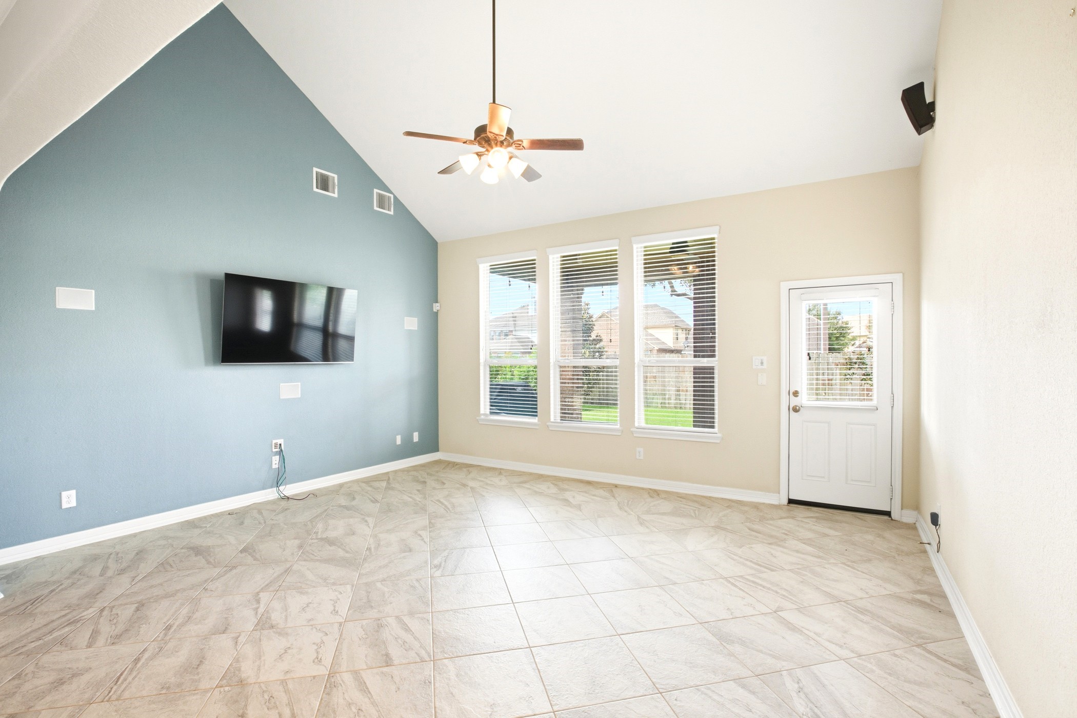 Soaring living room ceilings and plenty of natural light entering the space