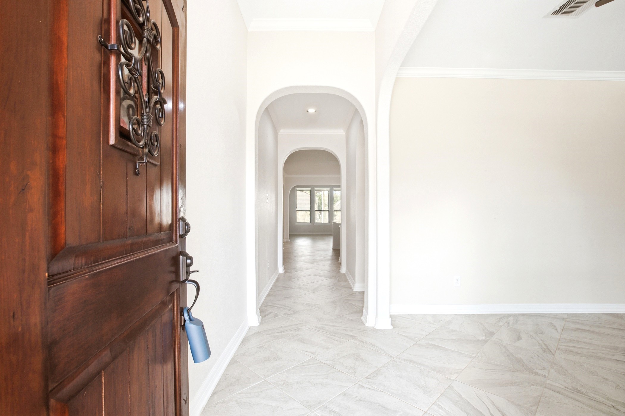 Welcome to high ceiling entrance with flex room located on the right