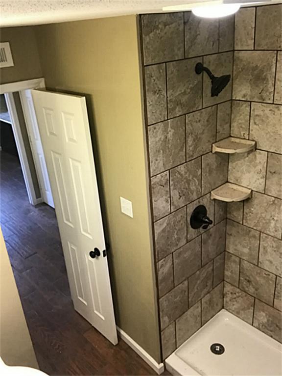 Tile shower with easy access and low step.
