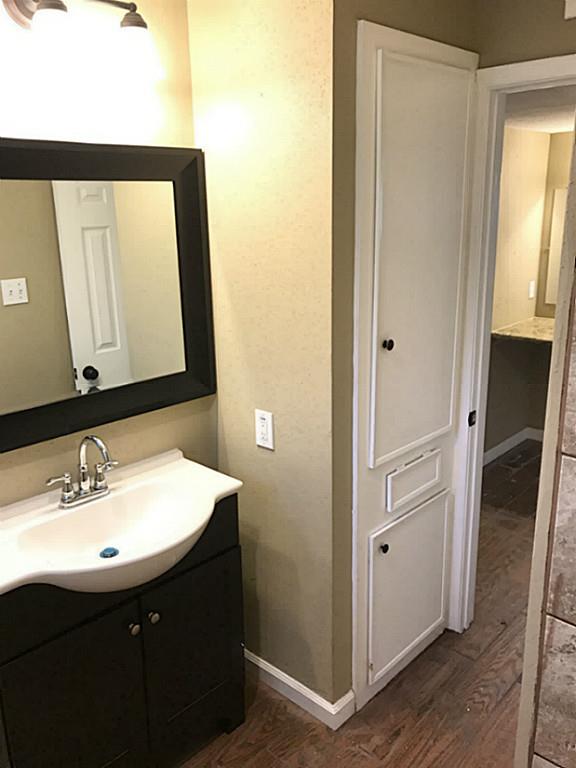 Huge mirror and built in cabinets in bathroom