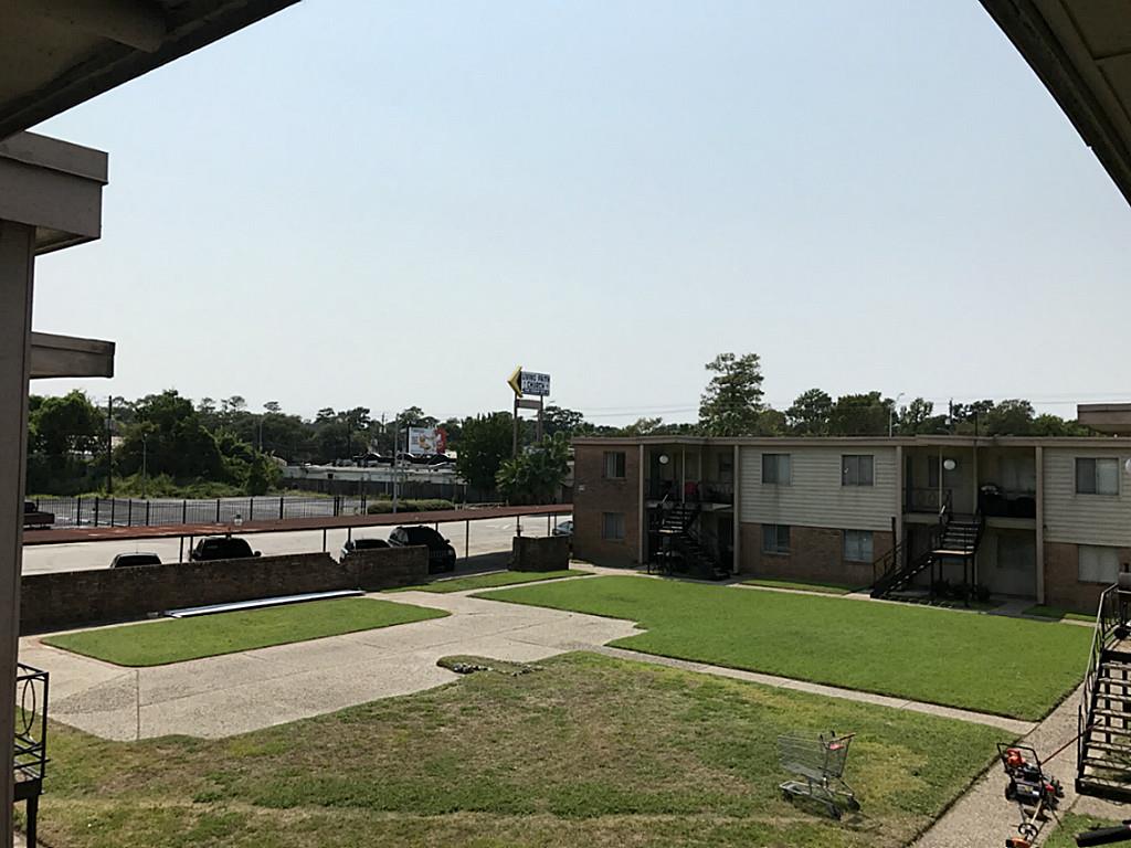 View from front porch of large courtyard