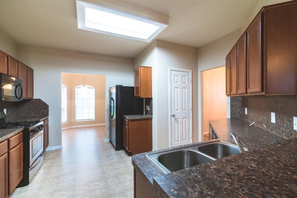 The kitchen is large and bright (Refrigerator NOT included).