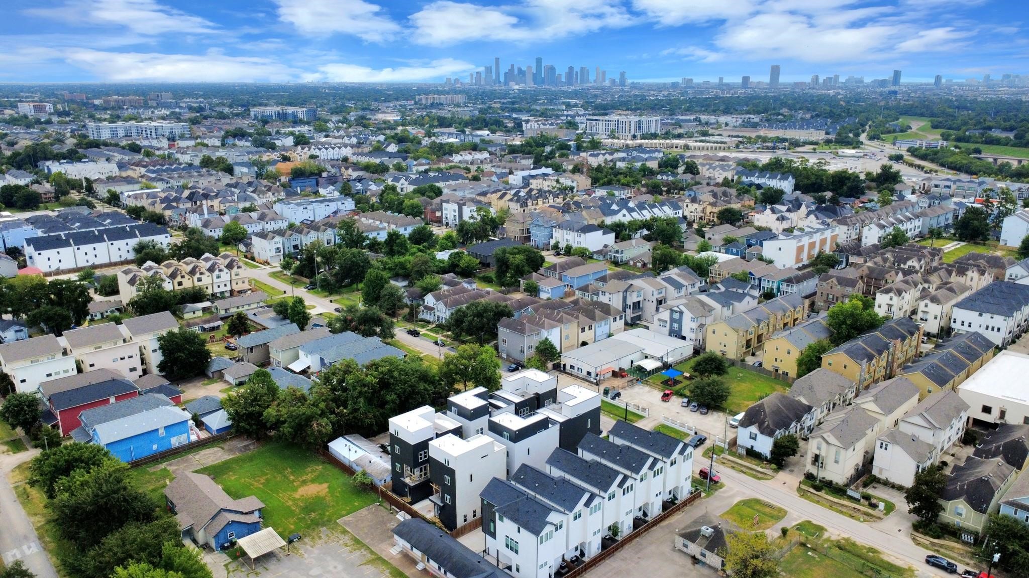 Aerial view featuring the Downtown Houston skyline in the distance.