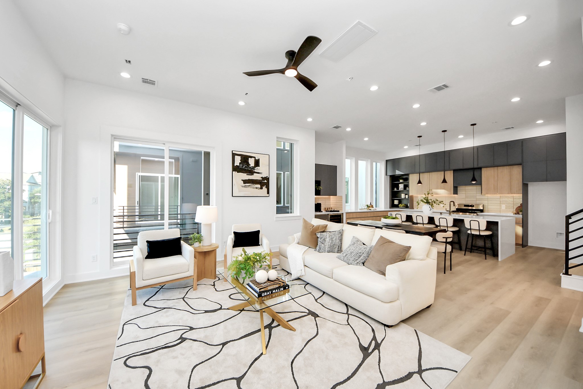 Open living space showcasing the seamless connection between the living, dining, and kitchen areas.