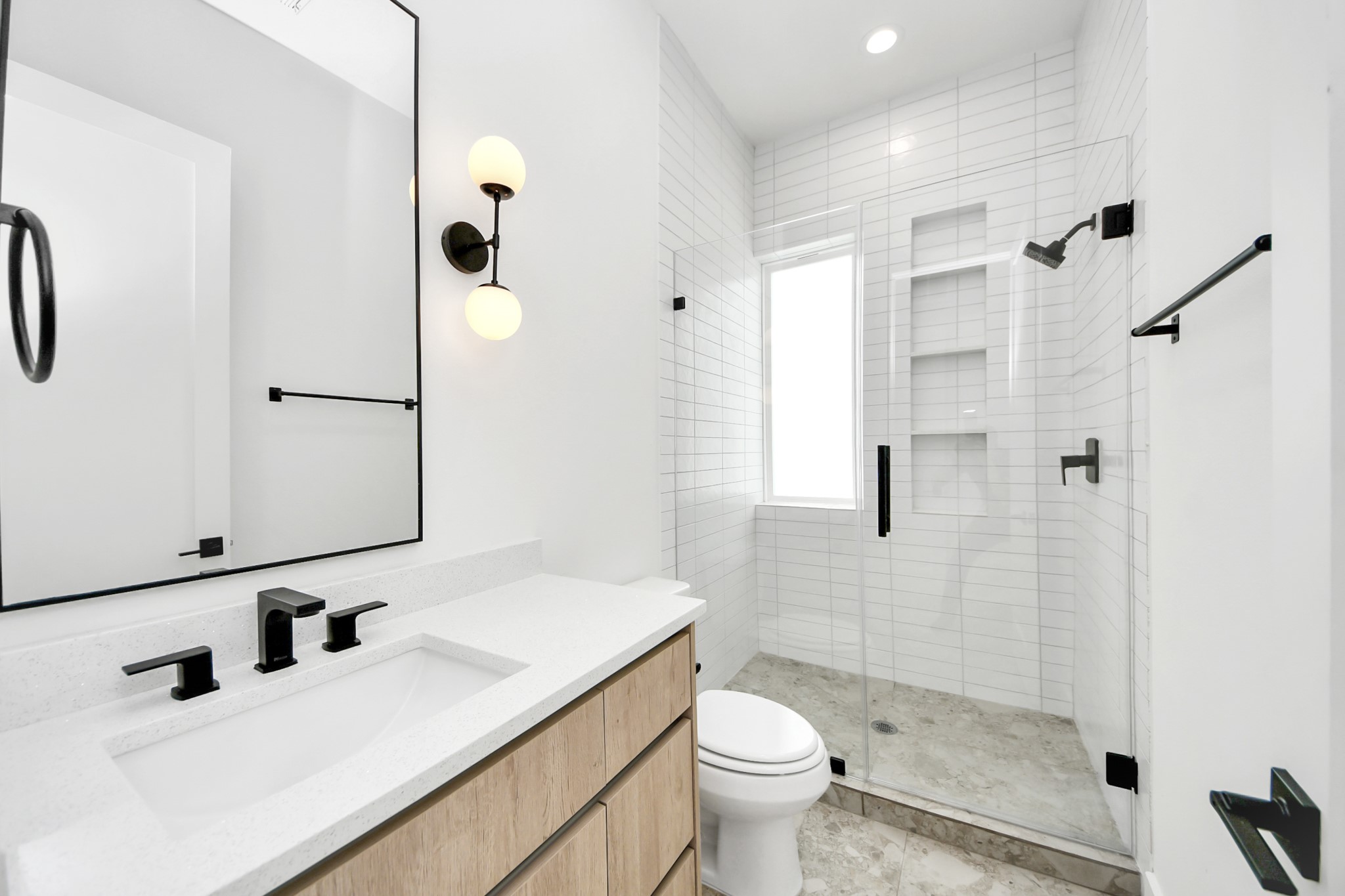 Full bathroom serving the third-floor secondary bedroom.