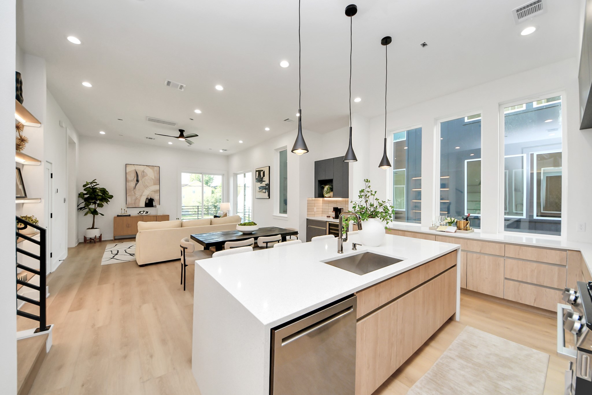 Open-concept kitchen flows seamlessly into the dining and living areas, ideal for entertaining.