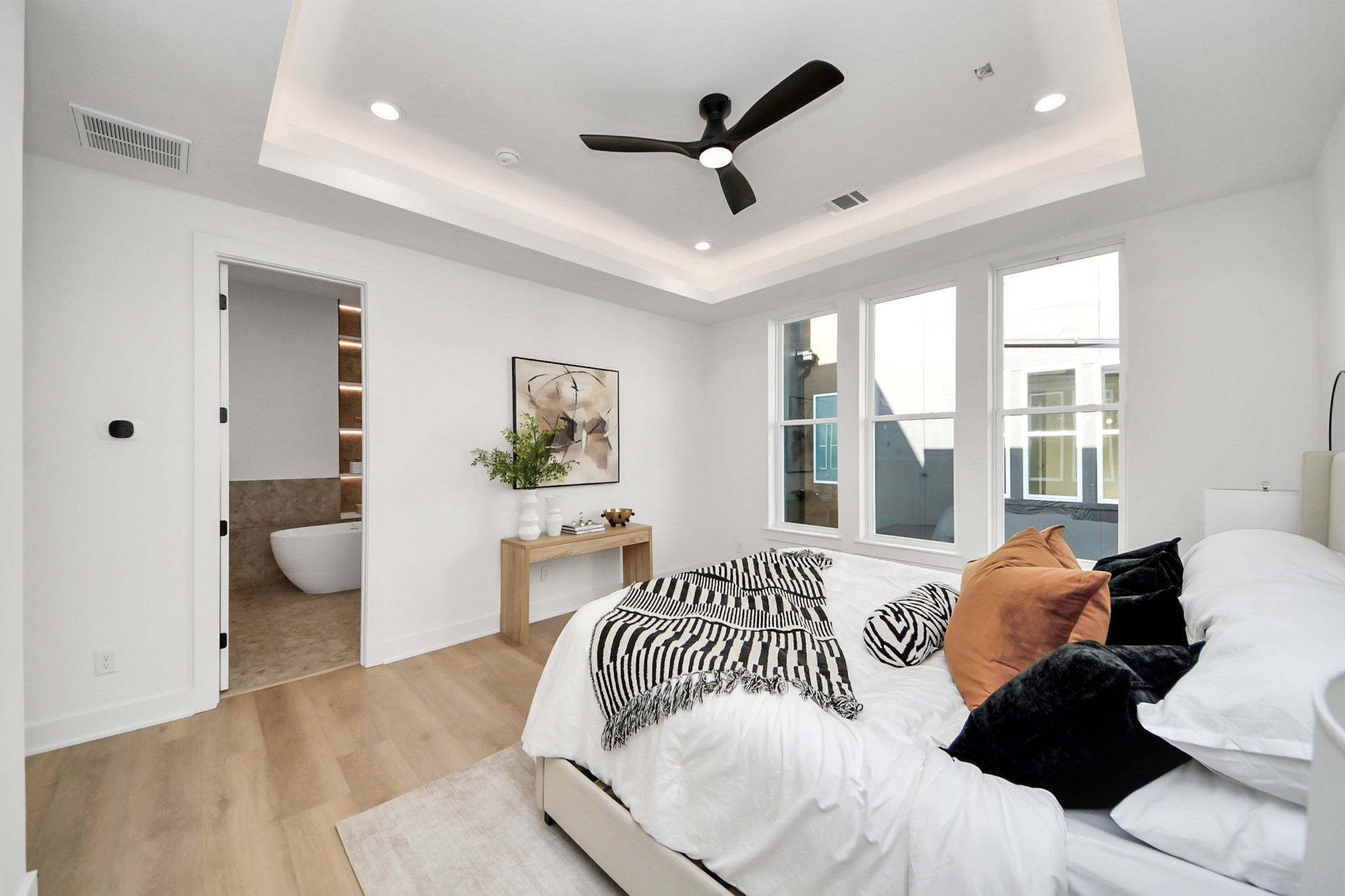 Primary bedroom with convenient access to the walk-in closet and ensuite bathroom.