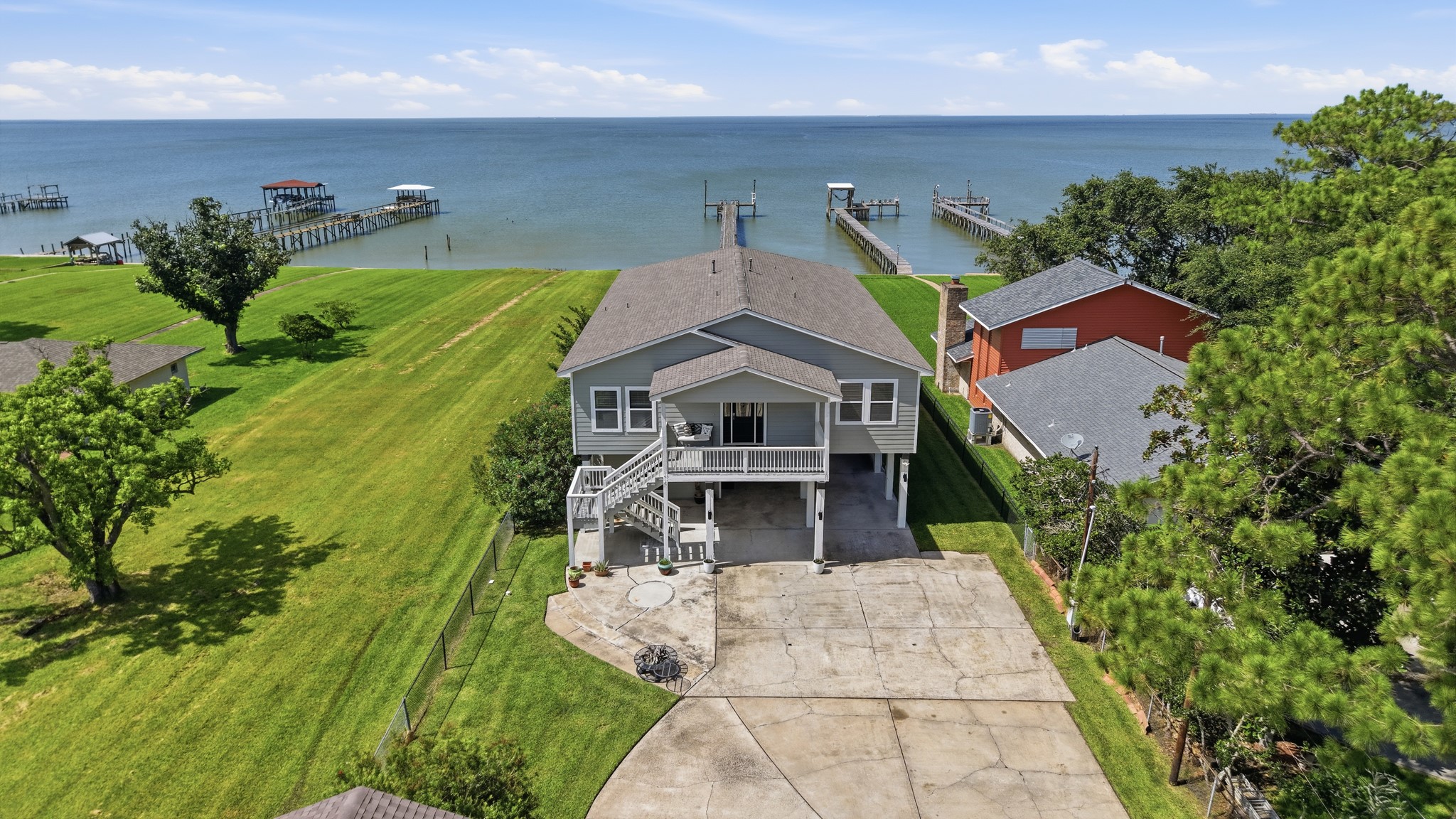 An aerial view showcasing your magnificent, elevated waterfront estate.