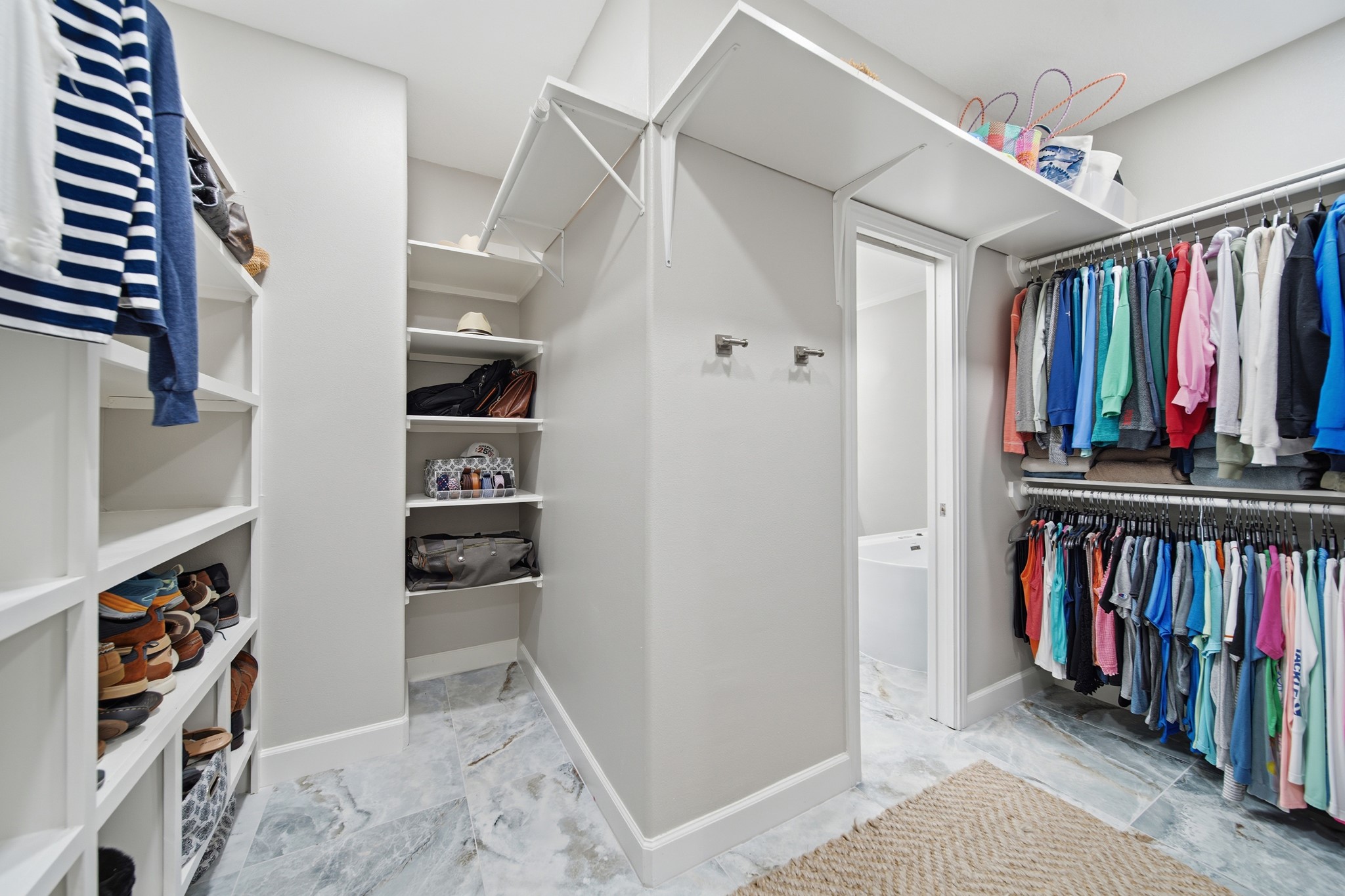 Unpack and settle into this custom-built boutique closet system.