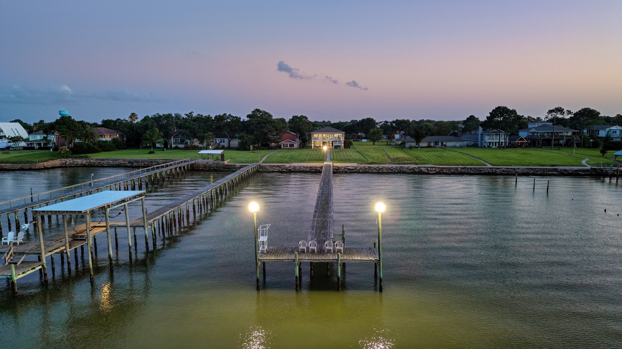 Step out onto your private pier and breathe in the evening bay breeze.
