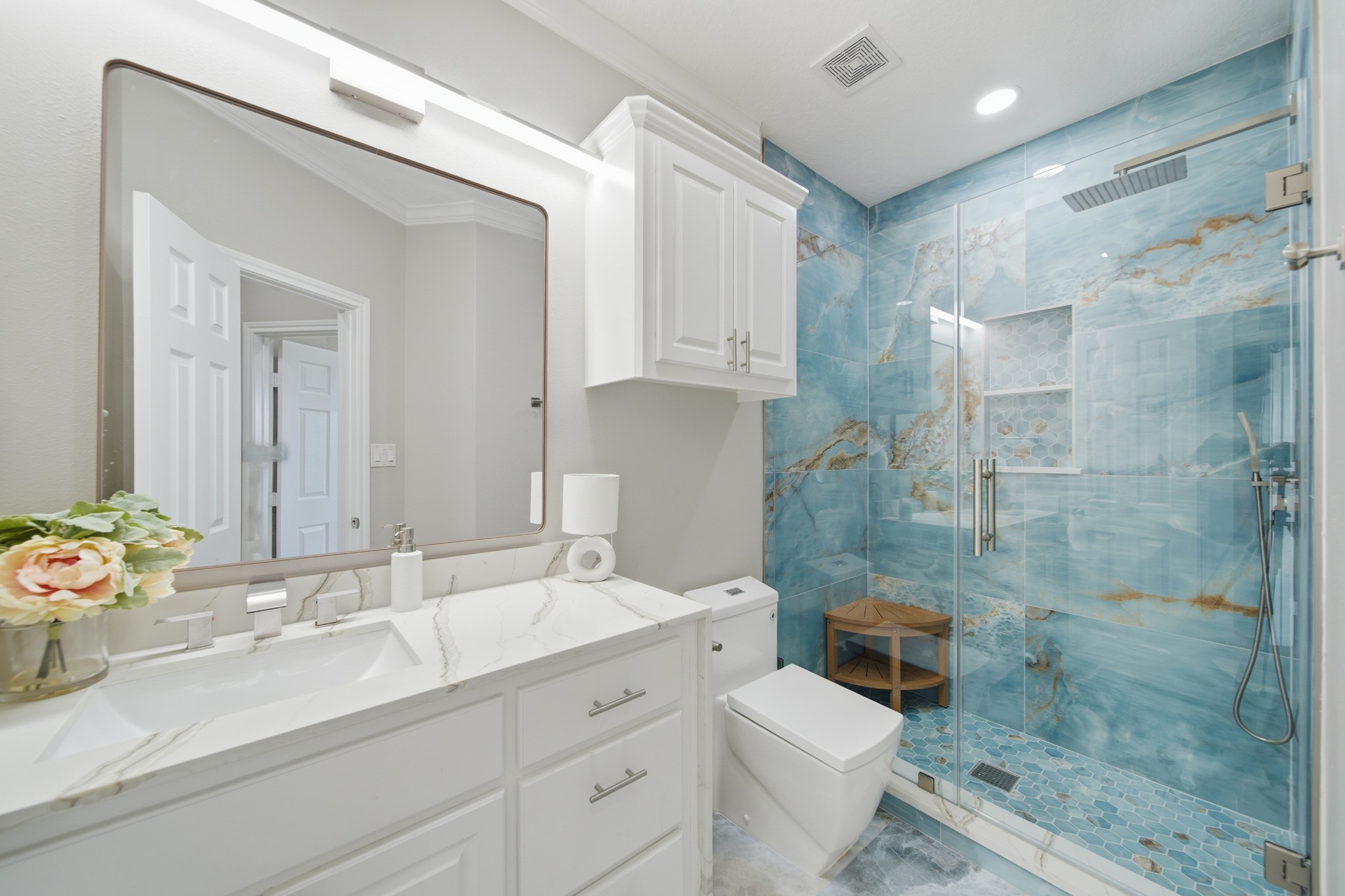 Immerse yourself in a beautifully curated space with premium custom tilework.