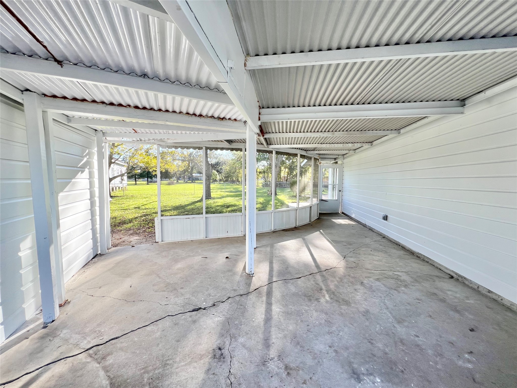 Love this covered and screened in back patio area!  Just imagine entertaining family and friends for Thanksgiving and Christmas, you can put on a spread right here.