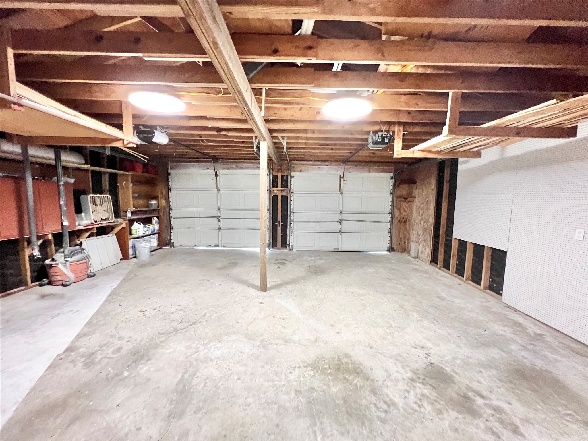Auto garage door openers on both bays, peg boards galore to hang all your tools.  Park your boat, side by side, four wheelers and additional vehicles here!