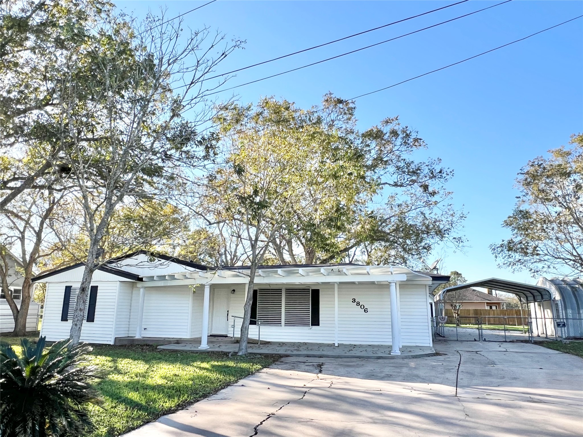 You have an oversized 2 car Carport, lots of extra parking with the long double wide driveway in front plus more parking on 1st St. around the corner.