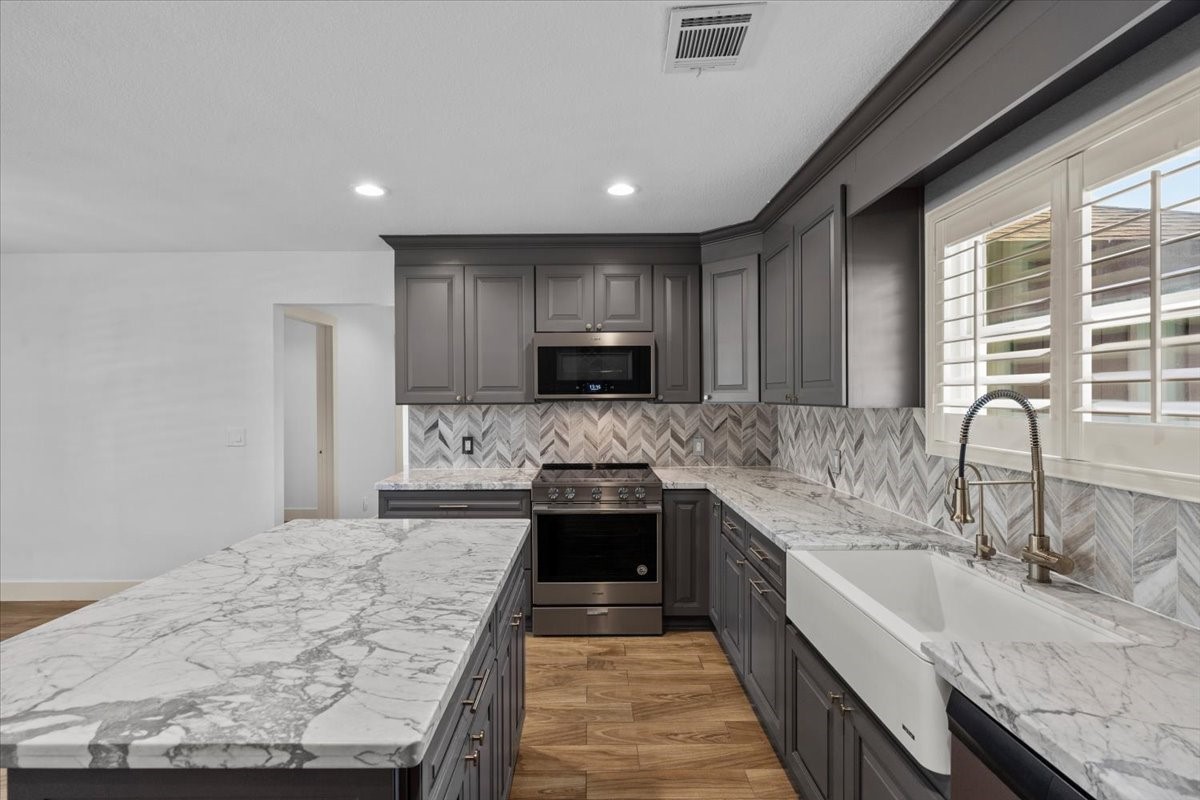 Calacatta Carrara countertops and marble backsplash