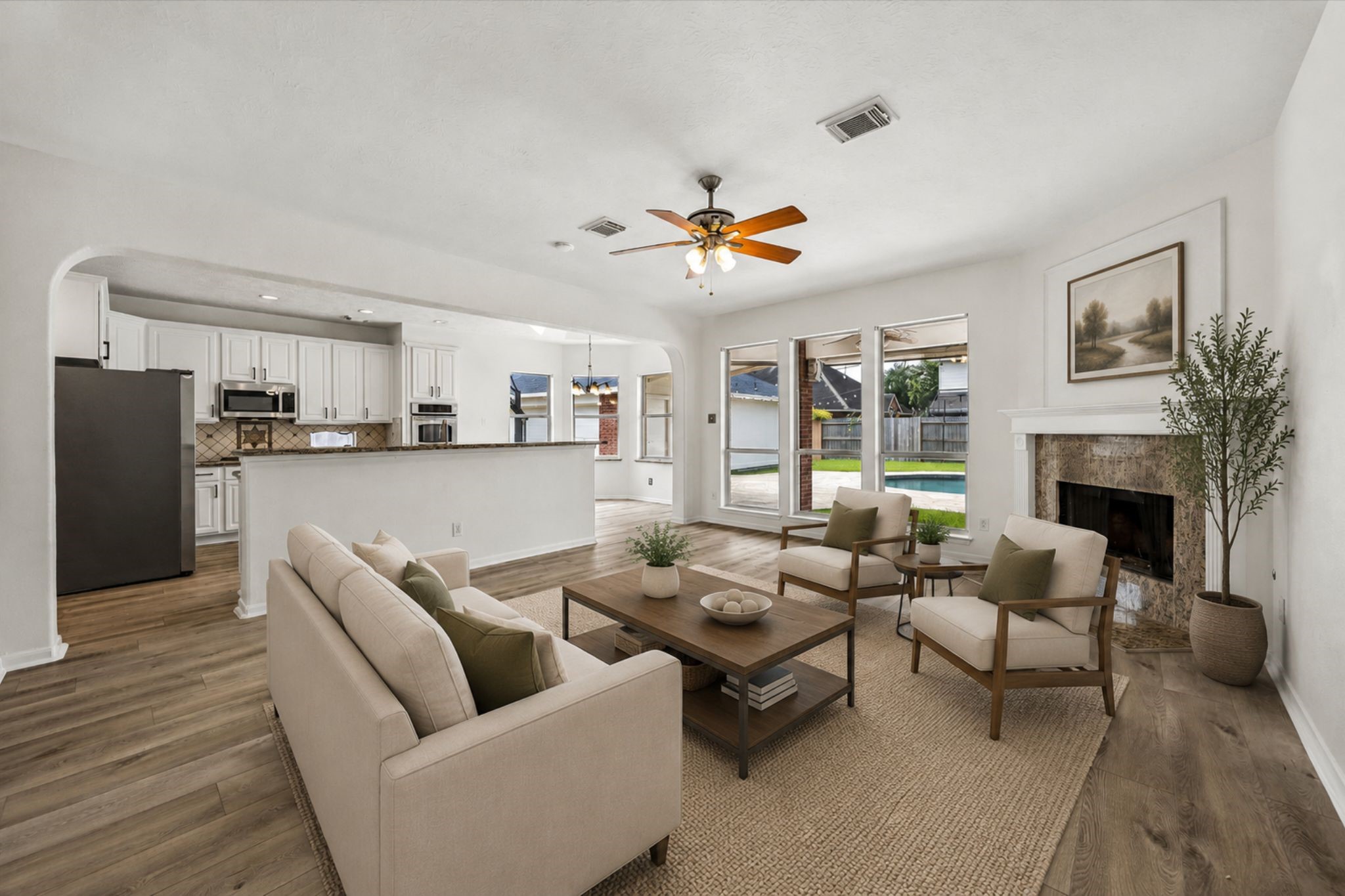 The open-concept family room flows seamlessly into the kitchen, creating the perfect space for everyday living and entertaining.**Virtually Stage.