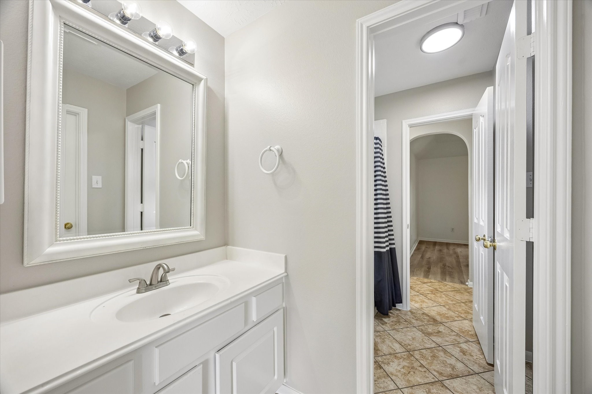A convenient upstairs vanity provides extra space for busy mornings.