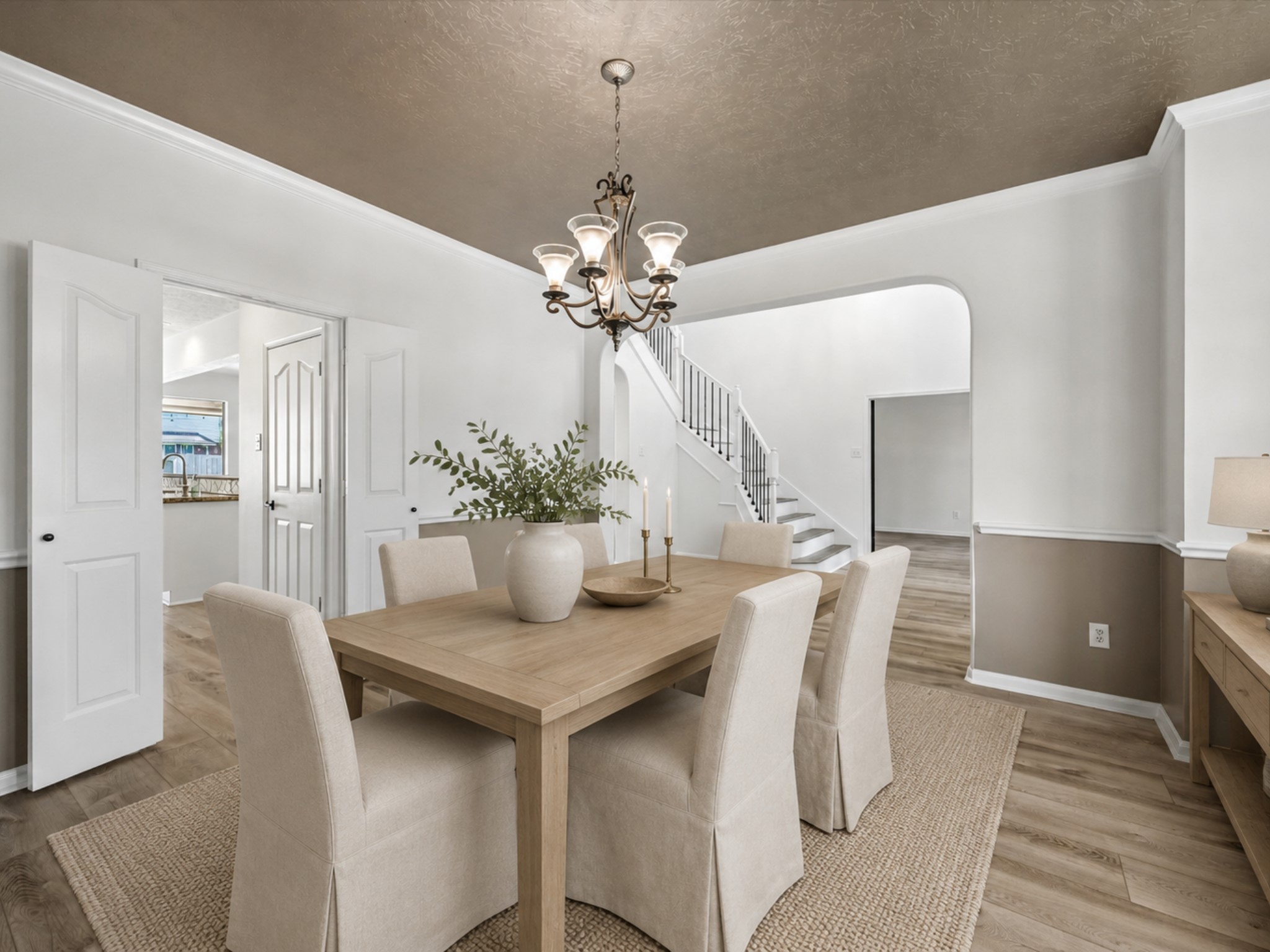 Another view of the spacious dining room highlights its open connection to the foyer and main living areas. **Virtually Stage.