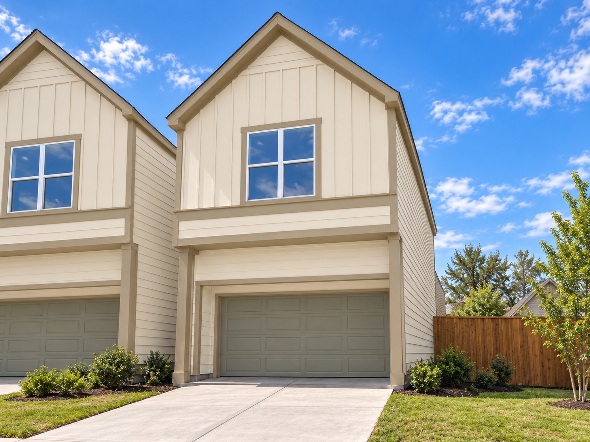 Welcome to this beautifully designed two-story residence featuring timeless architectural details and inviting curb appeal. The light-colored exterior siding, decorative board-and-batten accents, and crisp trim create a clean, sophisticated appearance. A prominent front-facing gable adds visual interest, while the attached two-car garage and wide driveway offer convenient access. These photos have been virtually rendered for visual reference.