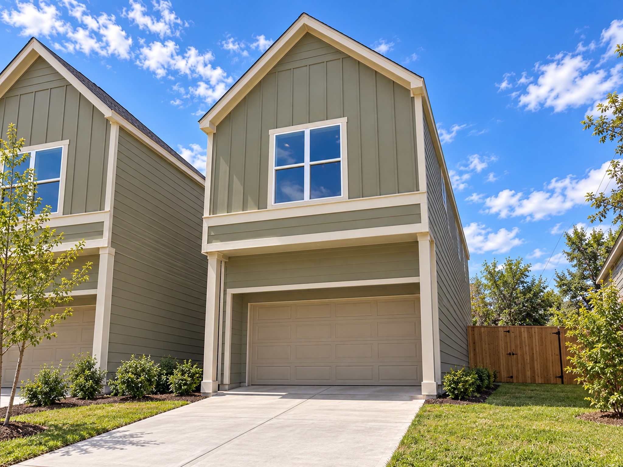 Discover this attractive two-story home showcasing modern farmhouse-inspired architecture and beautiful curb appeal. The exterior features sophisticated muted green siding, crisp white trim, and a charming front-facing gable that adds architectural character. An attached two-car garage and spacious concrete driveway provide convenient parking. Fresh landscaping, manicured lawn areas, and a wooden privacy fence enhance the outdoor setting. These photos have been virtually rendered for visual reference. Discover this attractive two-story home showcasing modern farmhouse-inspired architecture and beautiful curb appeal. The exterior features sophisticated muted green siding, crisp white trim, and a charming front-facing gable that adds architectural character. An attached two-car garage and spacious concrete driveway provide convenient parking. Fresh landscaping, manicured lawn areas, and a wooden privacy fence enhance the outdoor setting. These photos have been virtually rendered for visual reference.