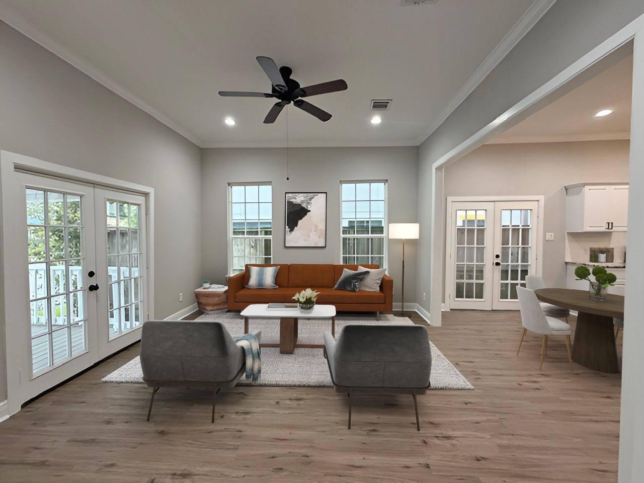 Virtually Staged: Spacious living room, virtually staged to illustrate furniture placement and the inviting layout, with an open connection to the adjoining dining area.