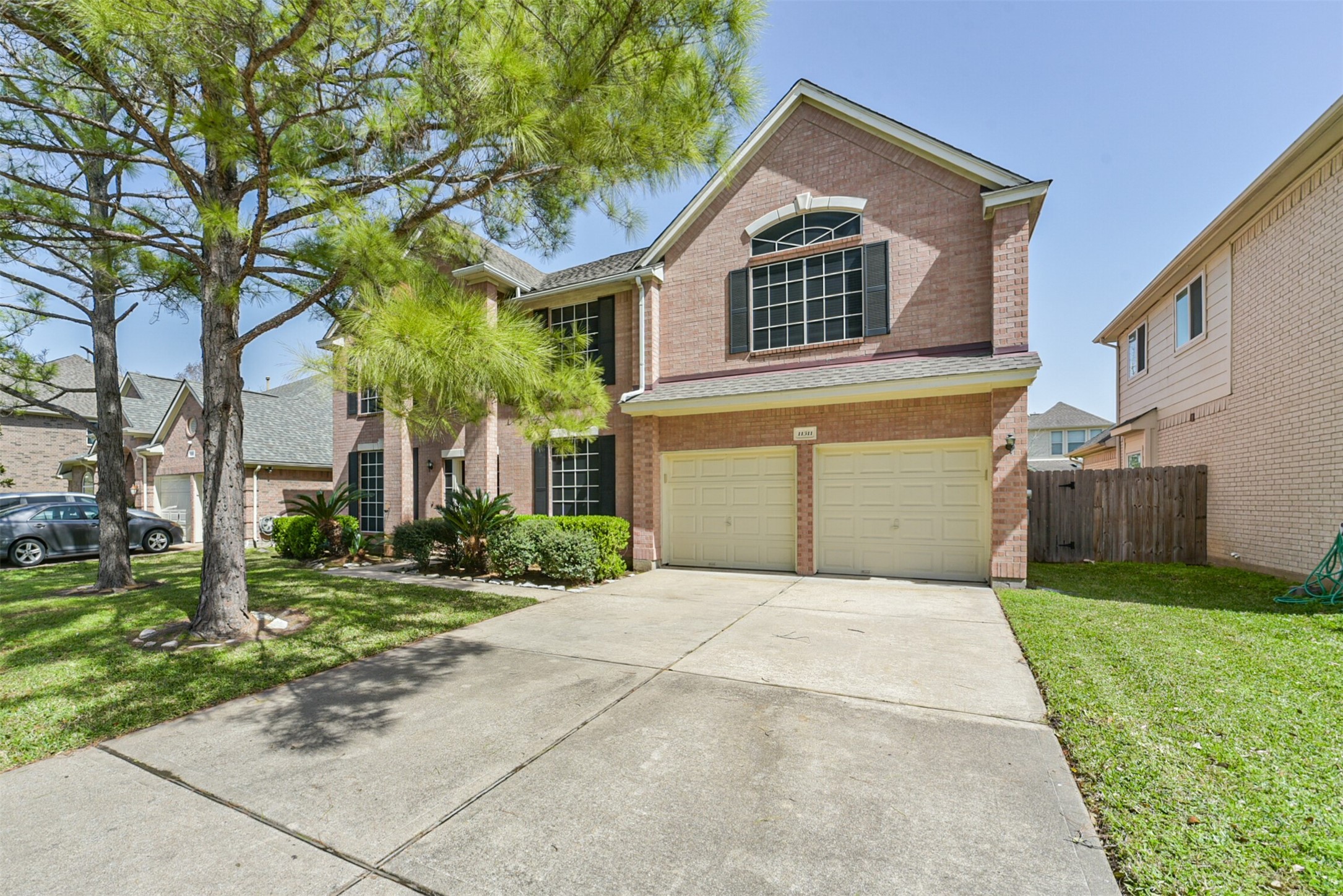 Attached 2-car garage and extended driveway.