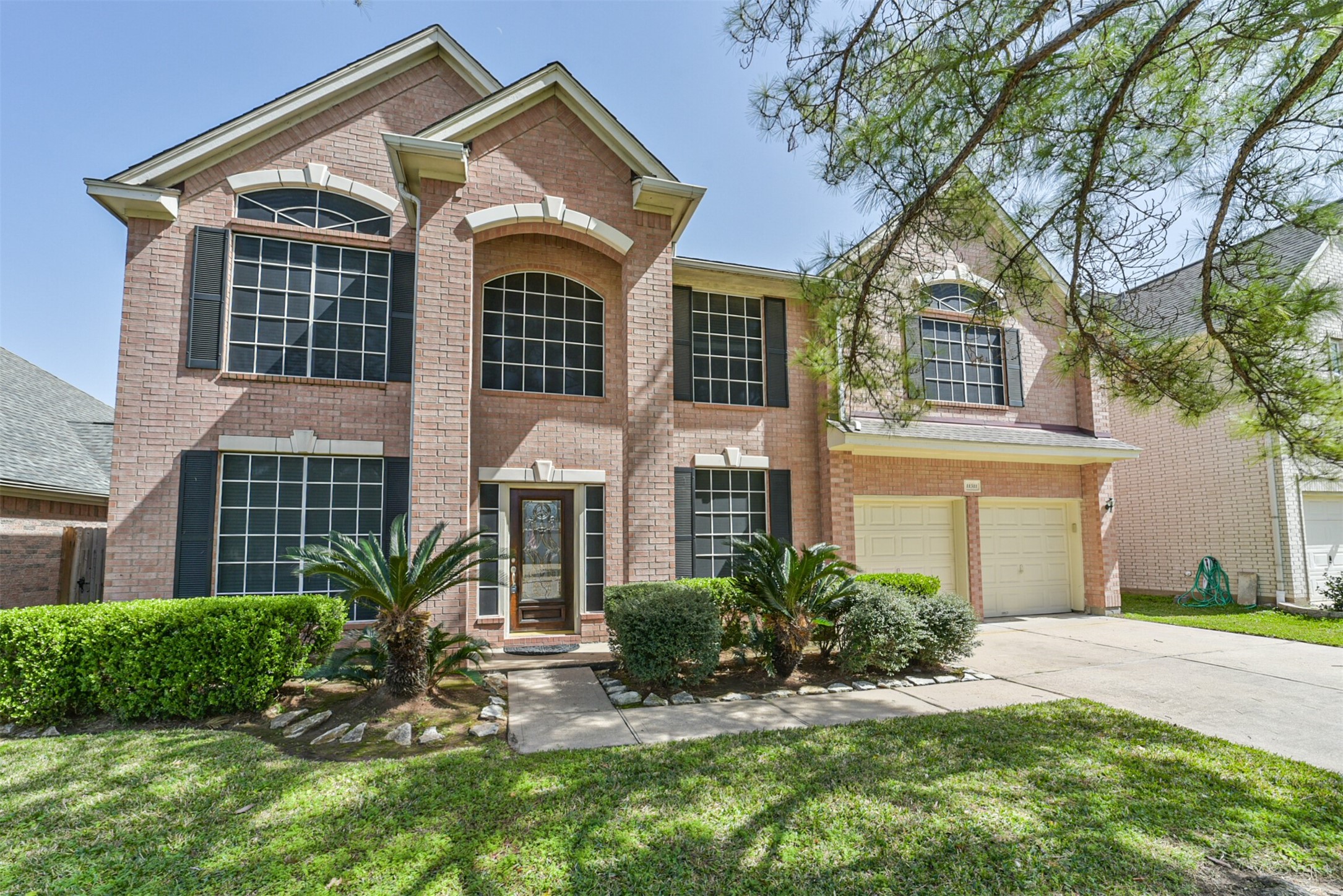 5 bed, 2.5 bath 2-story home on a cul-de-sac, with an attached 2-car garage and long driveway.