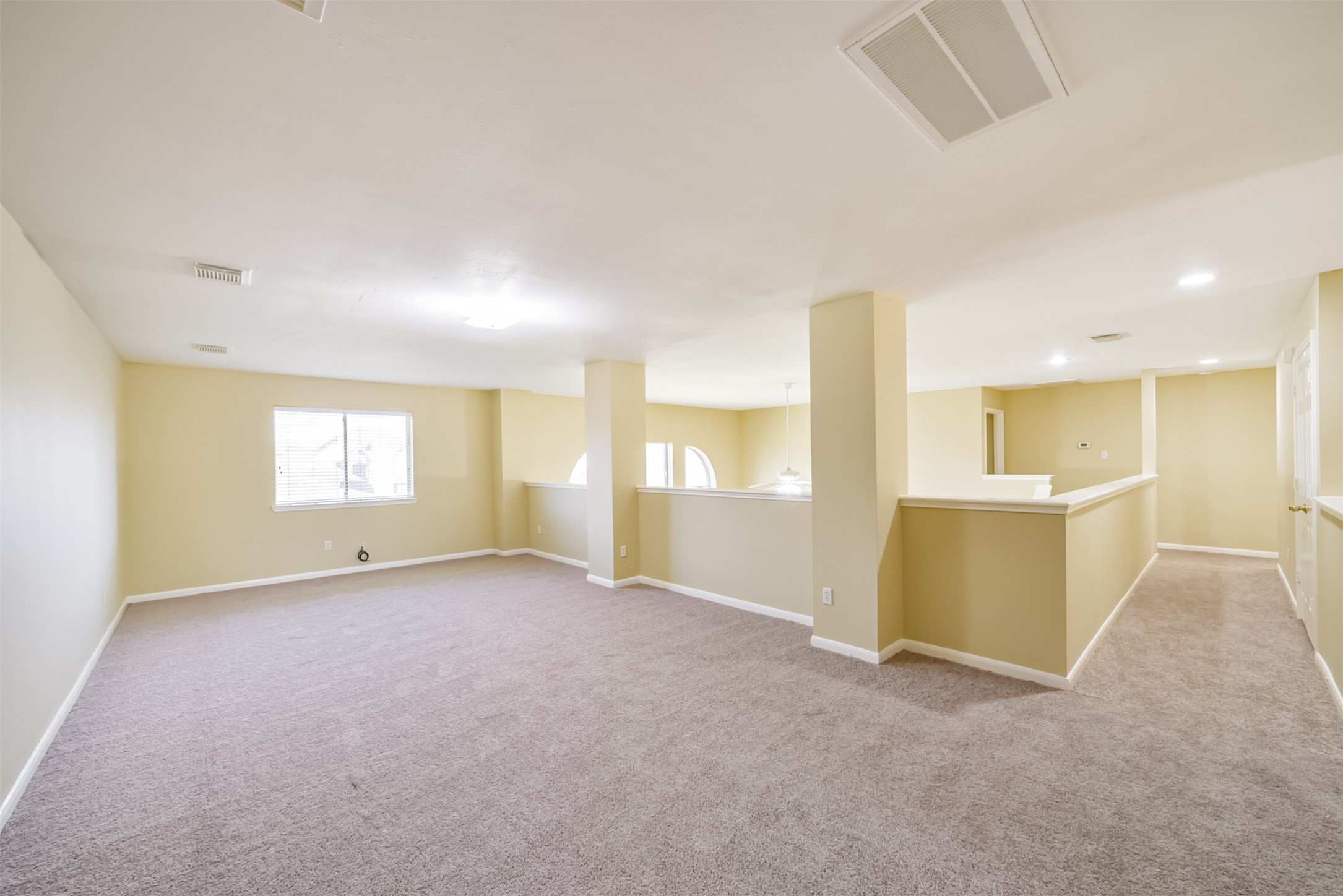 Upstairs den with generous space, positioned away from the bedrooms.