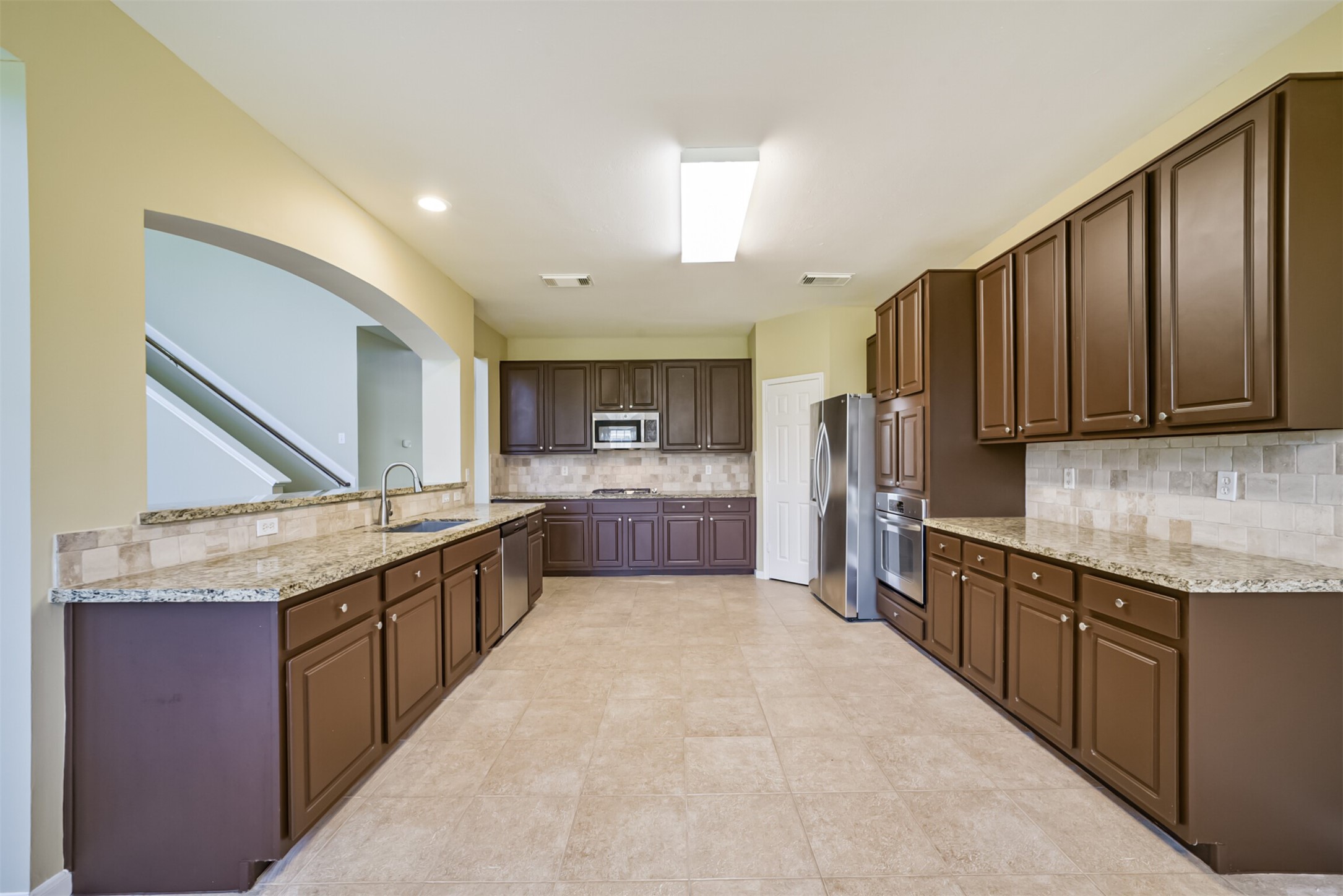 Spacious kitchen with abundant cabinet storage.