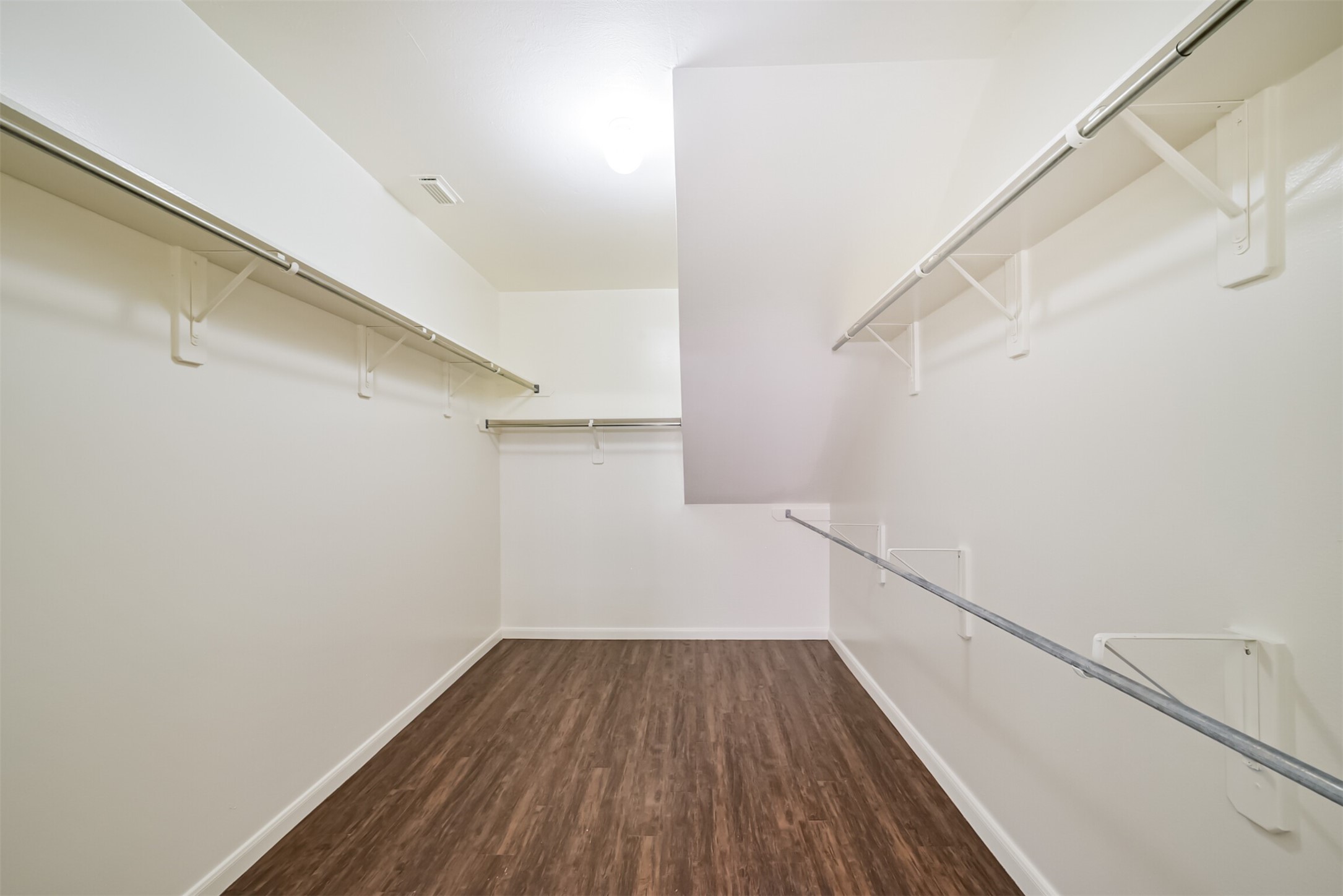 Spacious walk-in closet in the primary suite.