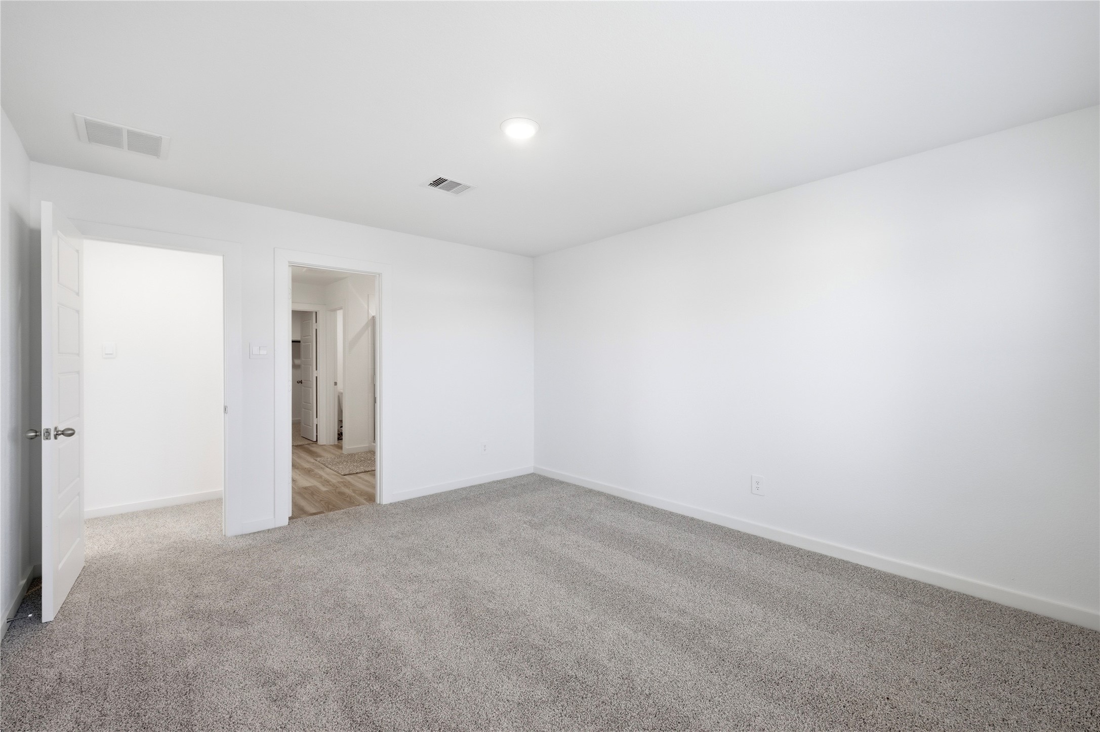 Another view of the large primary bedroom.