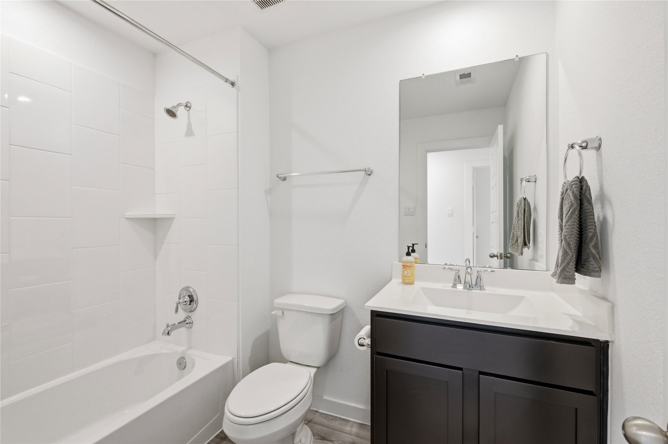 Full sized spare bath with shower/tub combo.
