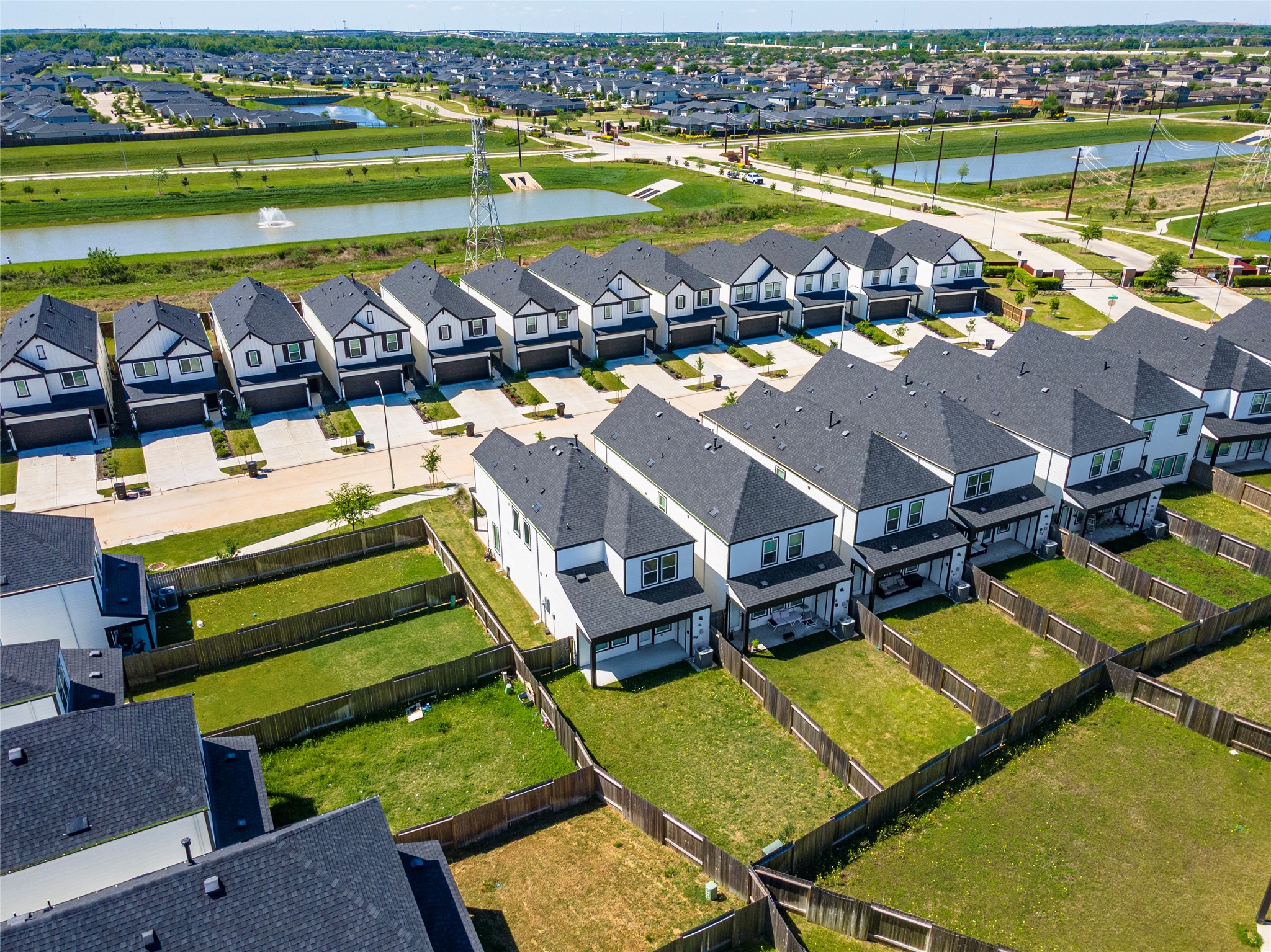 Aerial view of the large backyard and corner lot.