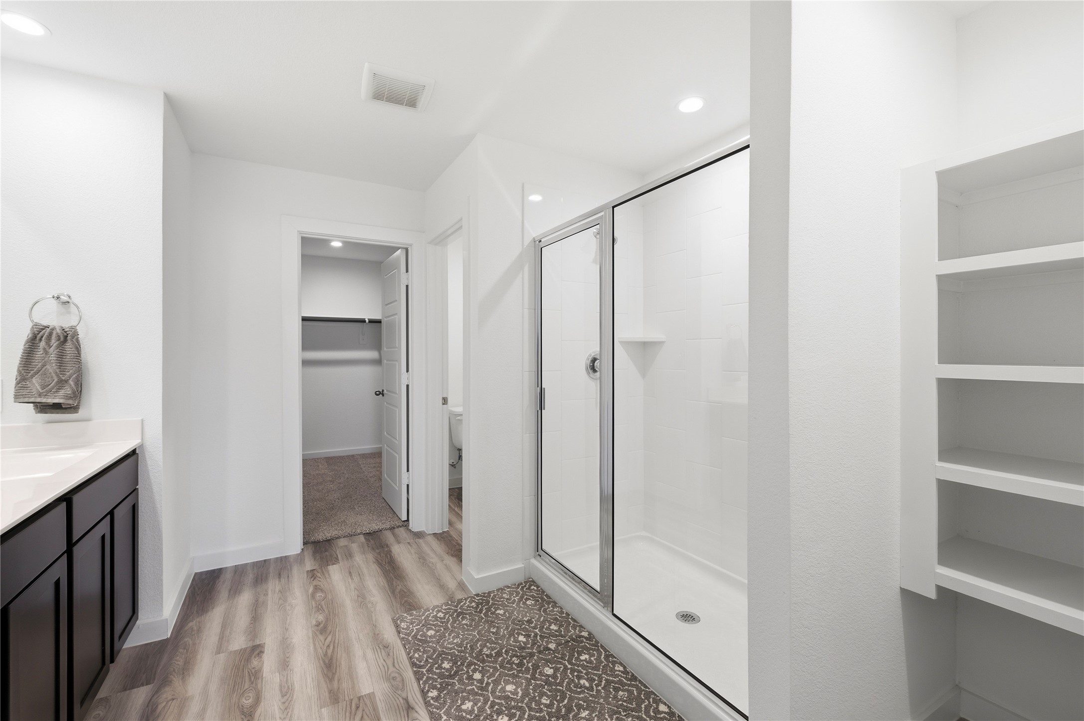 Spacious primary bath with walk in shower.